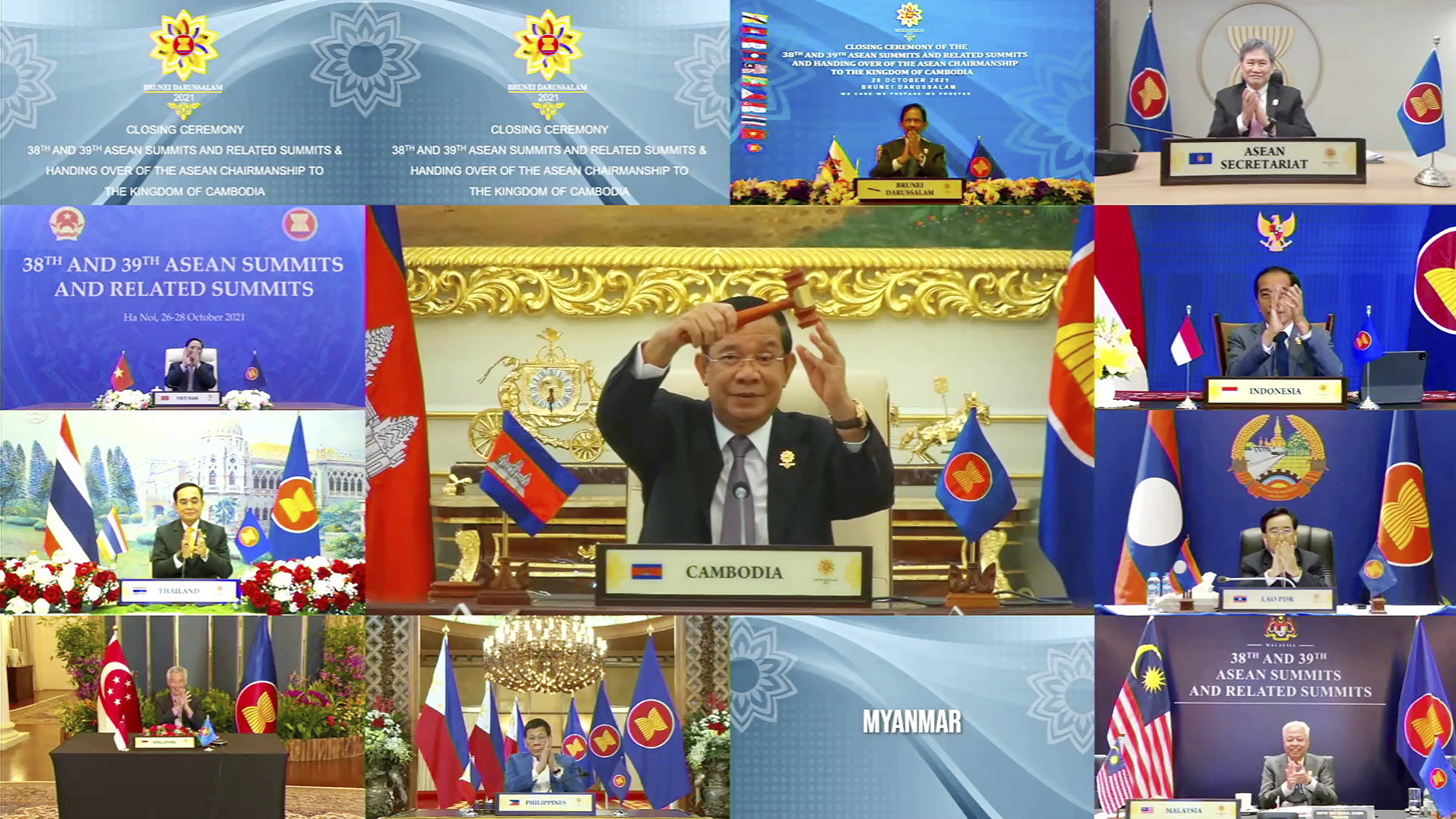 Cambodian Prime Minister Hun Sen holds up the gavel as his country takes over the chairmanship of ASEAN. The country has said it will maintain pressure on Myanmar amid the turmoil caused by the military’s February coup [Brunei ASEAN Summit via AP Photo]
