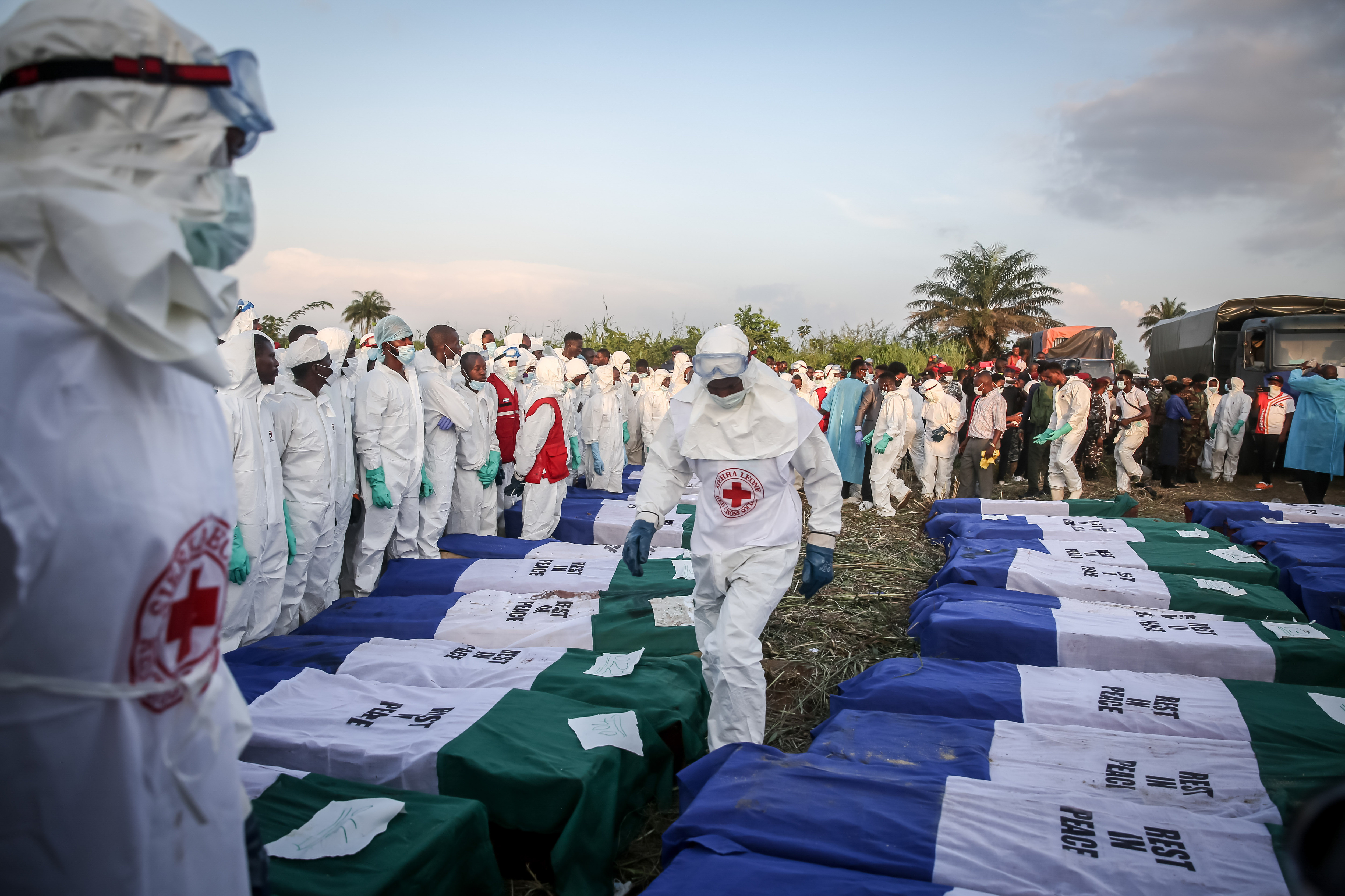 Coffins containing victims of the fuel tanker explosion seen lined up during a mass burial in Freetown