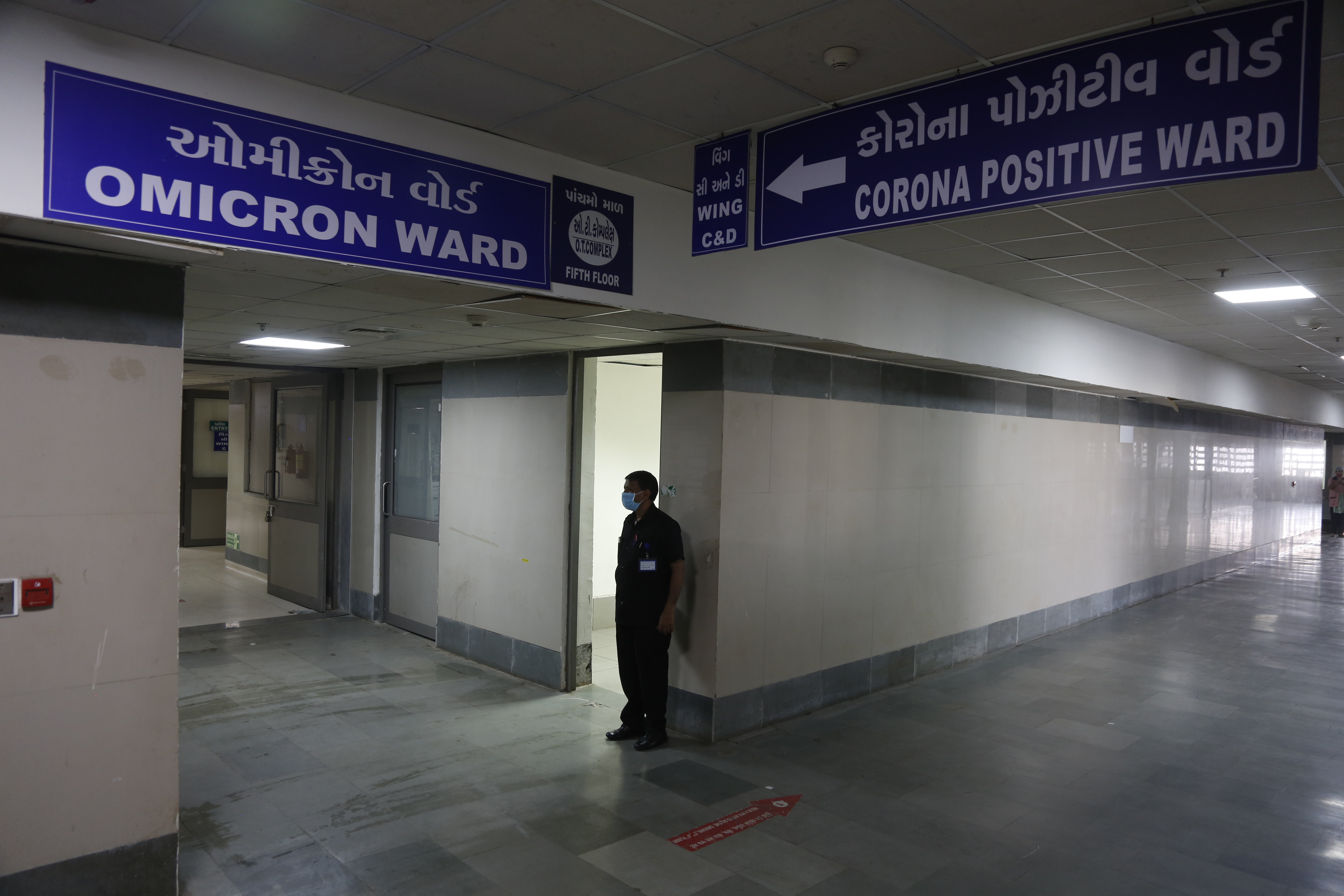 A security guard stands outside a ward being prepared for the Omicron coronavirus variant at a hospital in Ahmedabad city in Modi’s home state of Gujarat