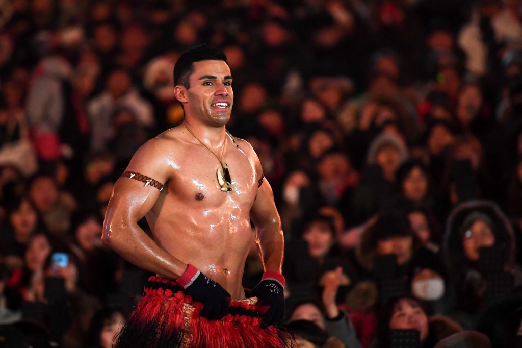 shirtless Tongan Olympian athlete