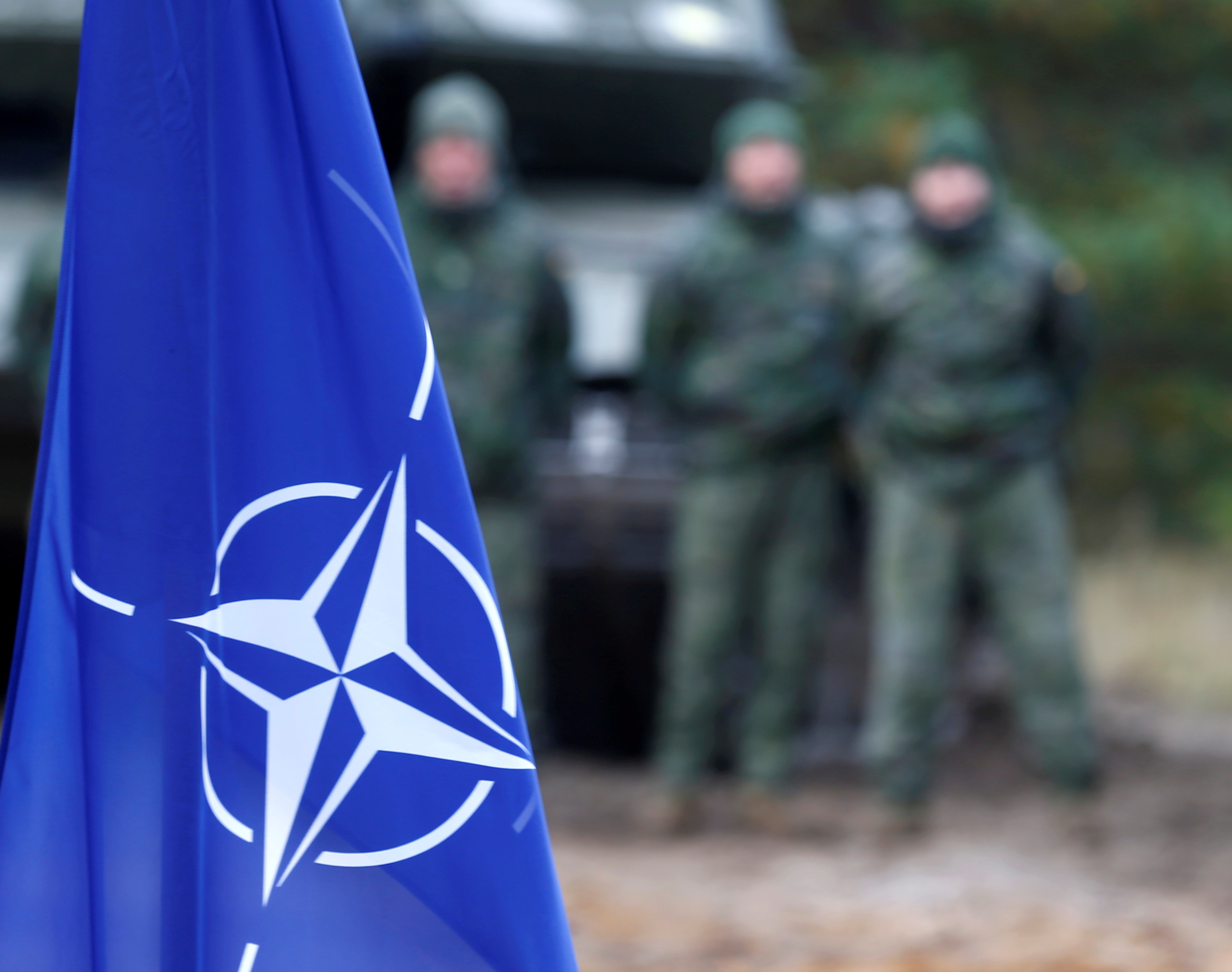 A NATO flag is seen during a military exercise in Adazi, Latvia.