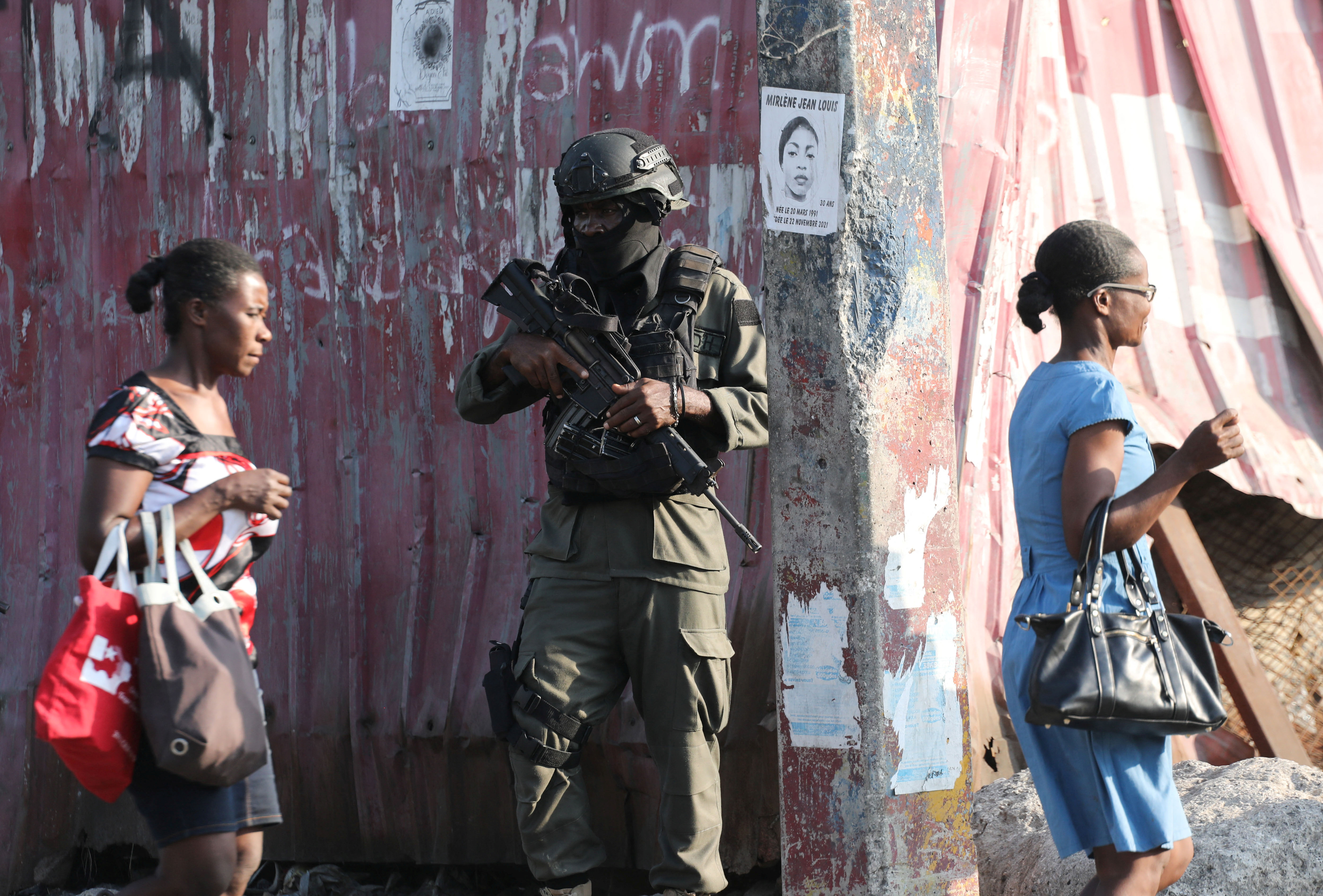 A member of Haitian Armed Forces stands guard near the presidential palace