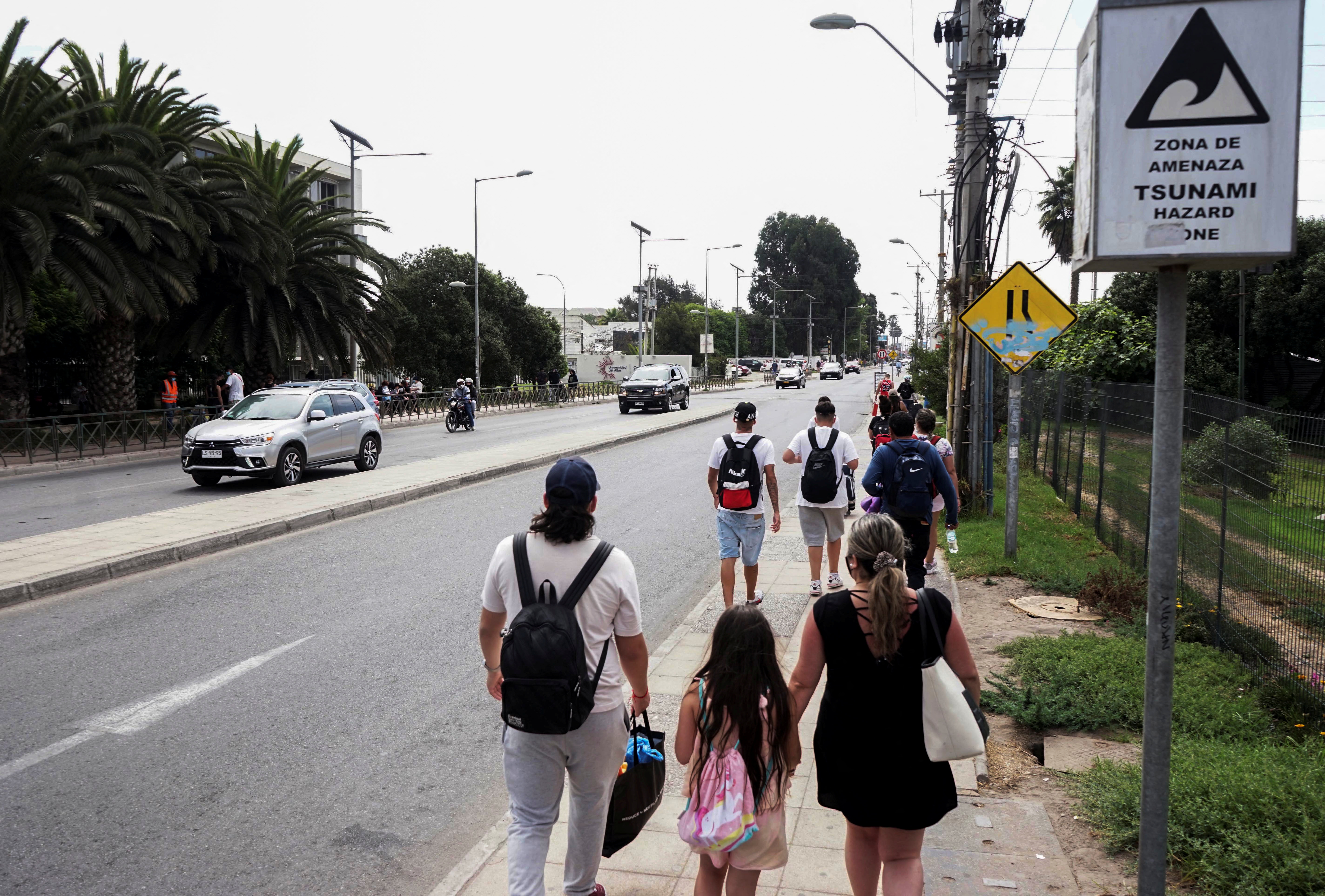 People evacuate the coastline in Chile