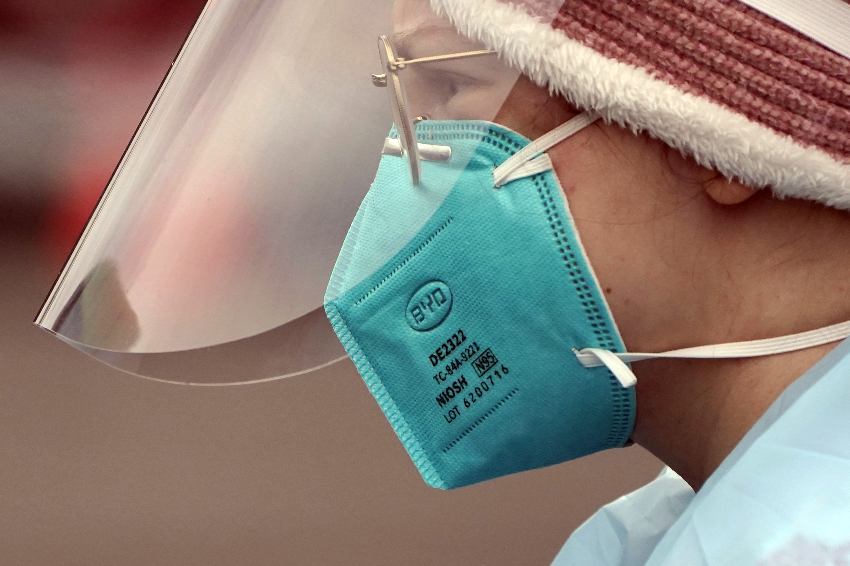 Medical worker wearing a mask and shield