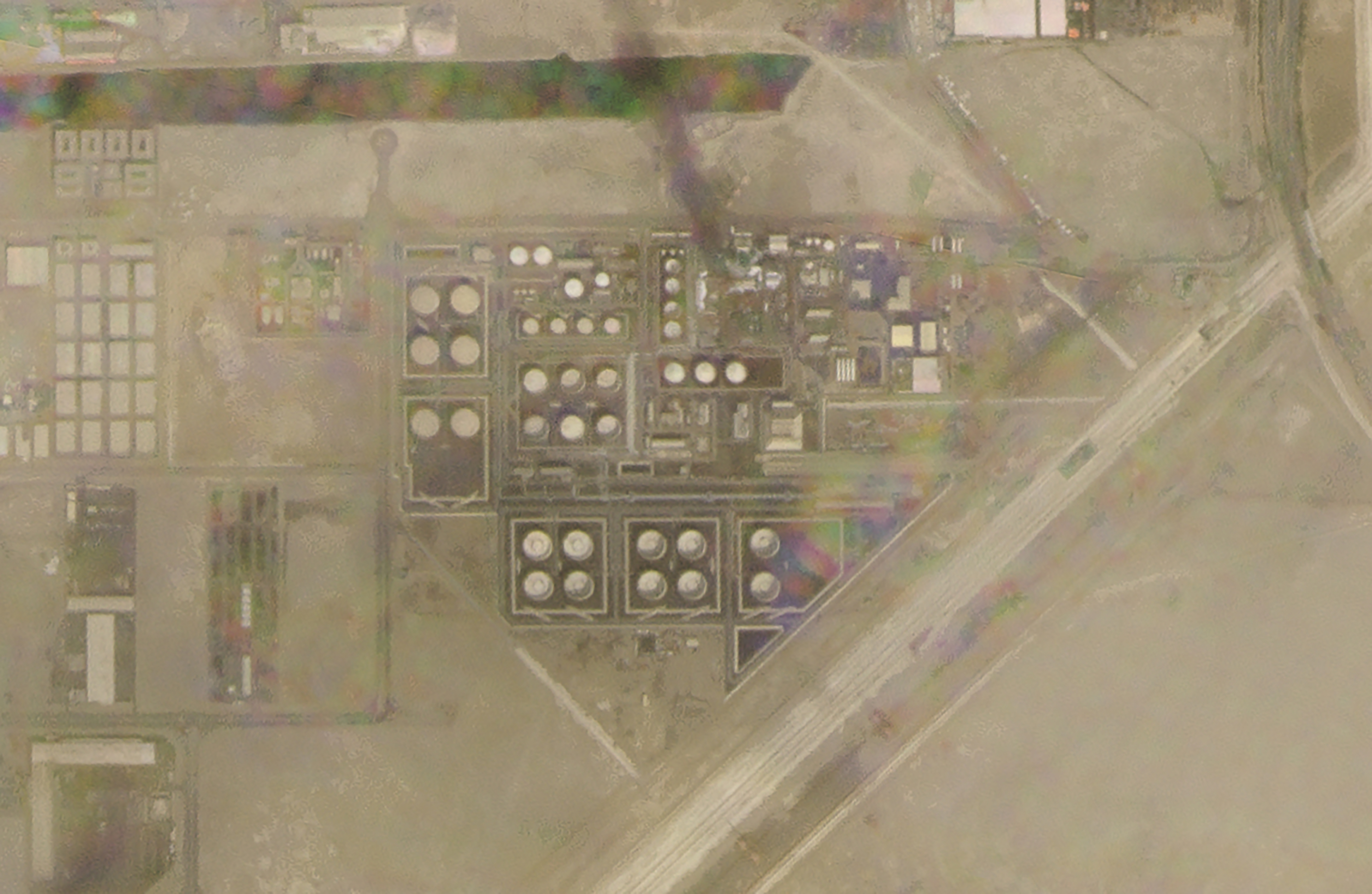 smoke rises over an Abu Dhabi National Oil Co. fuel depot