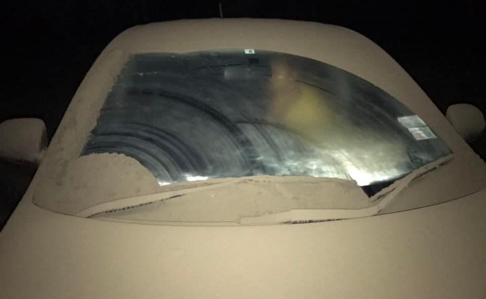 Tongatapu resident Tevita Fukofuka’s daughter Lote si’i seeks shelter in their vehicle as sulphur ash rained on the country following the eruption of Hunga Tonga-Hunga Ha’apai volcano [Courtesy of Tevita Fukofuka for Al Jazeera]