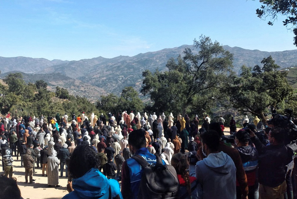 Mourners gather during the funeral of 5-year-old child, Rayan Awram
