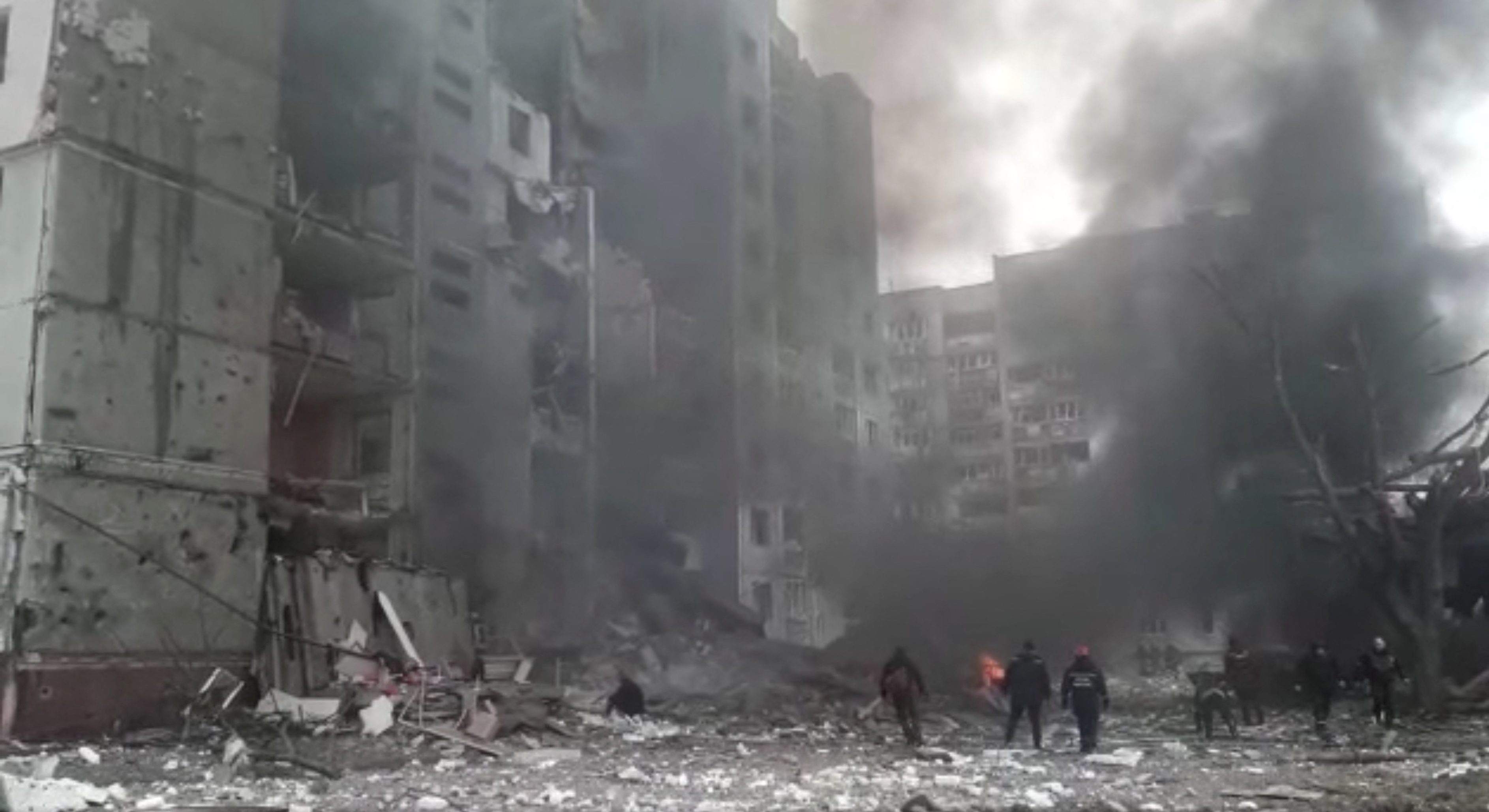 Workers clear the debris after the shelling attack by the Russian army, following Russia's invasion of Ukraine, in Chernihiv.