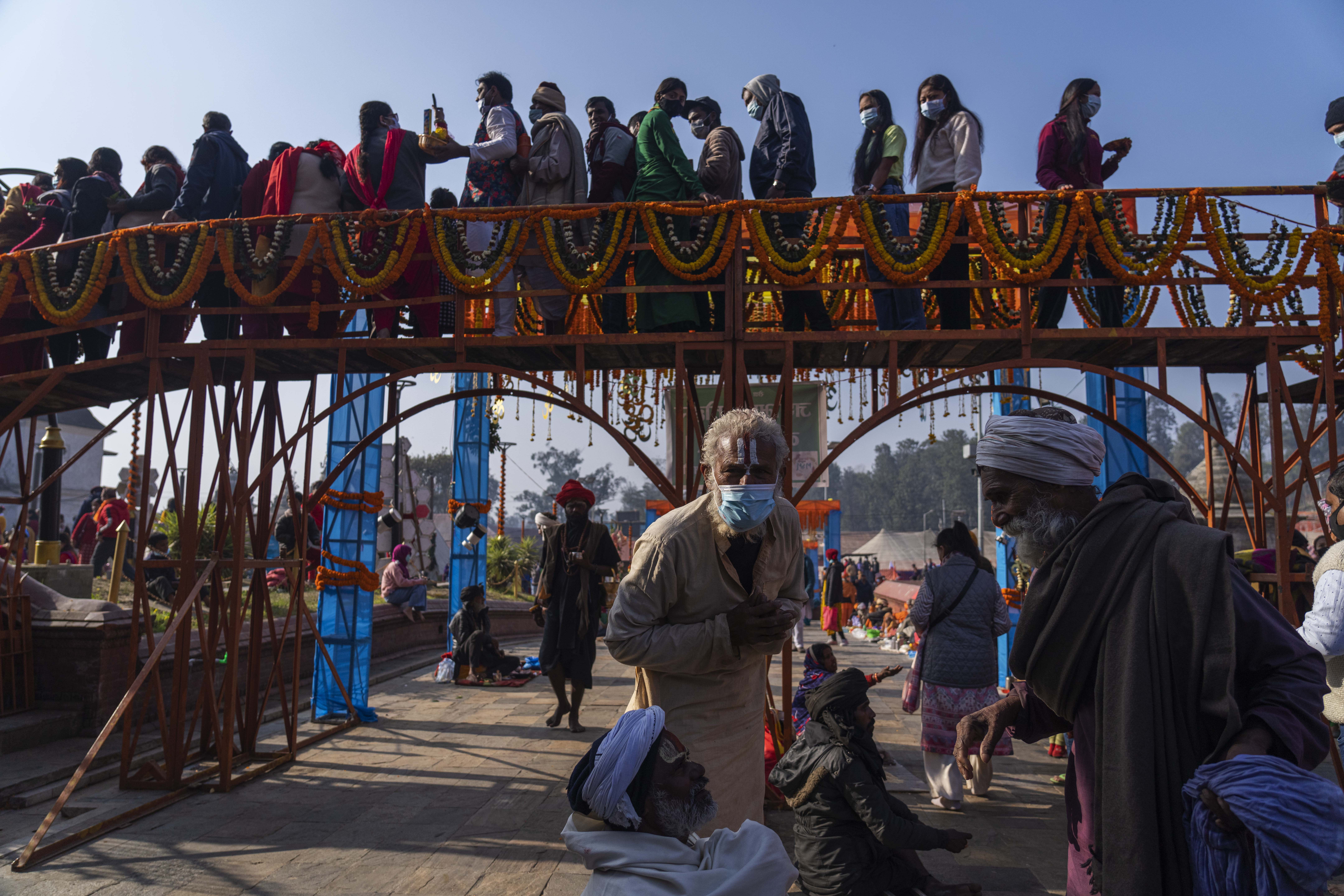 Devotees stand in a queue to enter the Pashupatinath Hindu temple