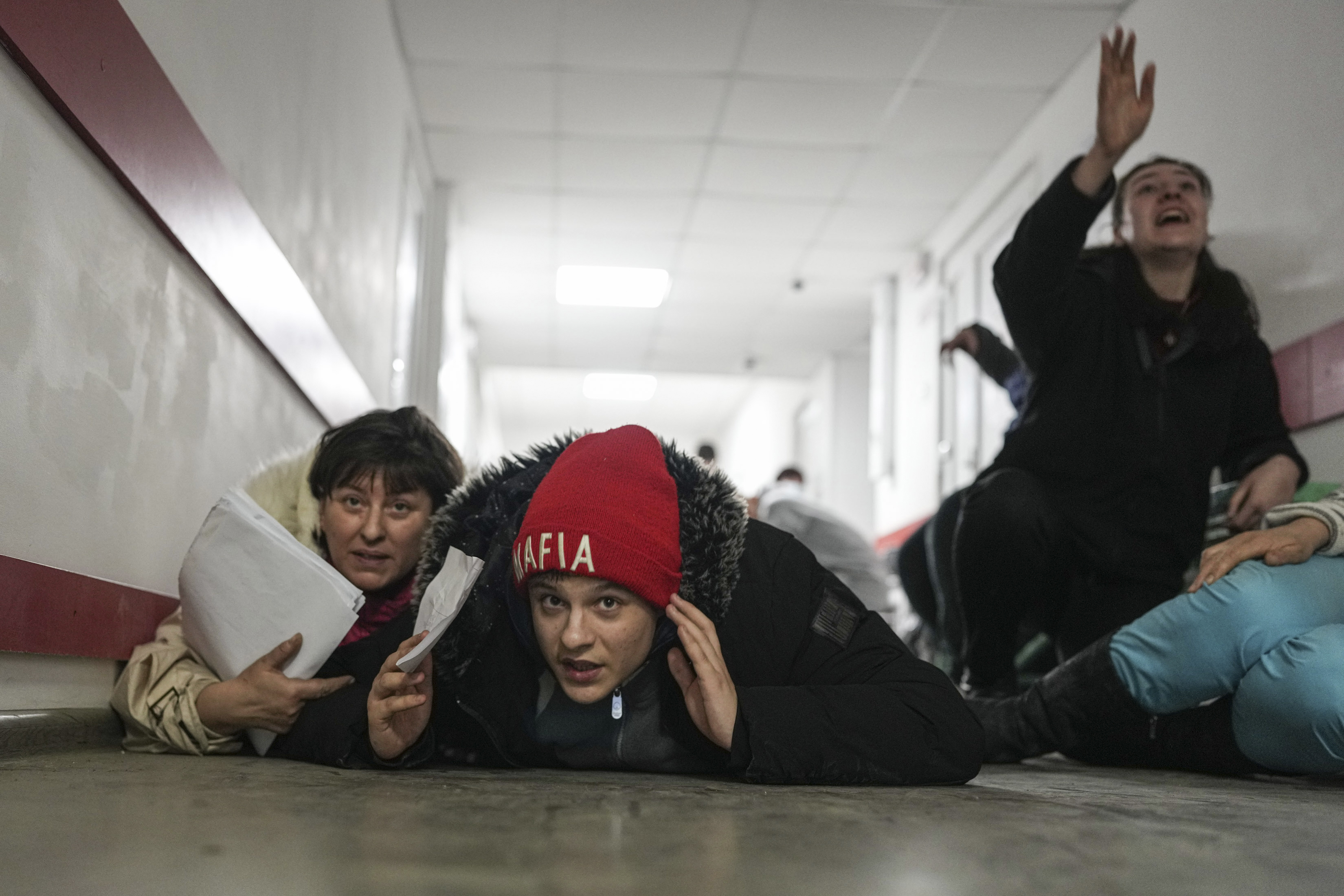 People lie on the floor of a hospital during shelling by Russian forces in Mariupol on March 4, 2022