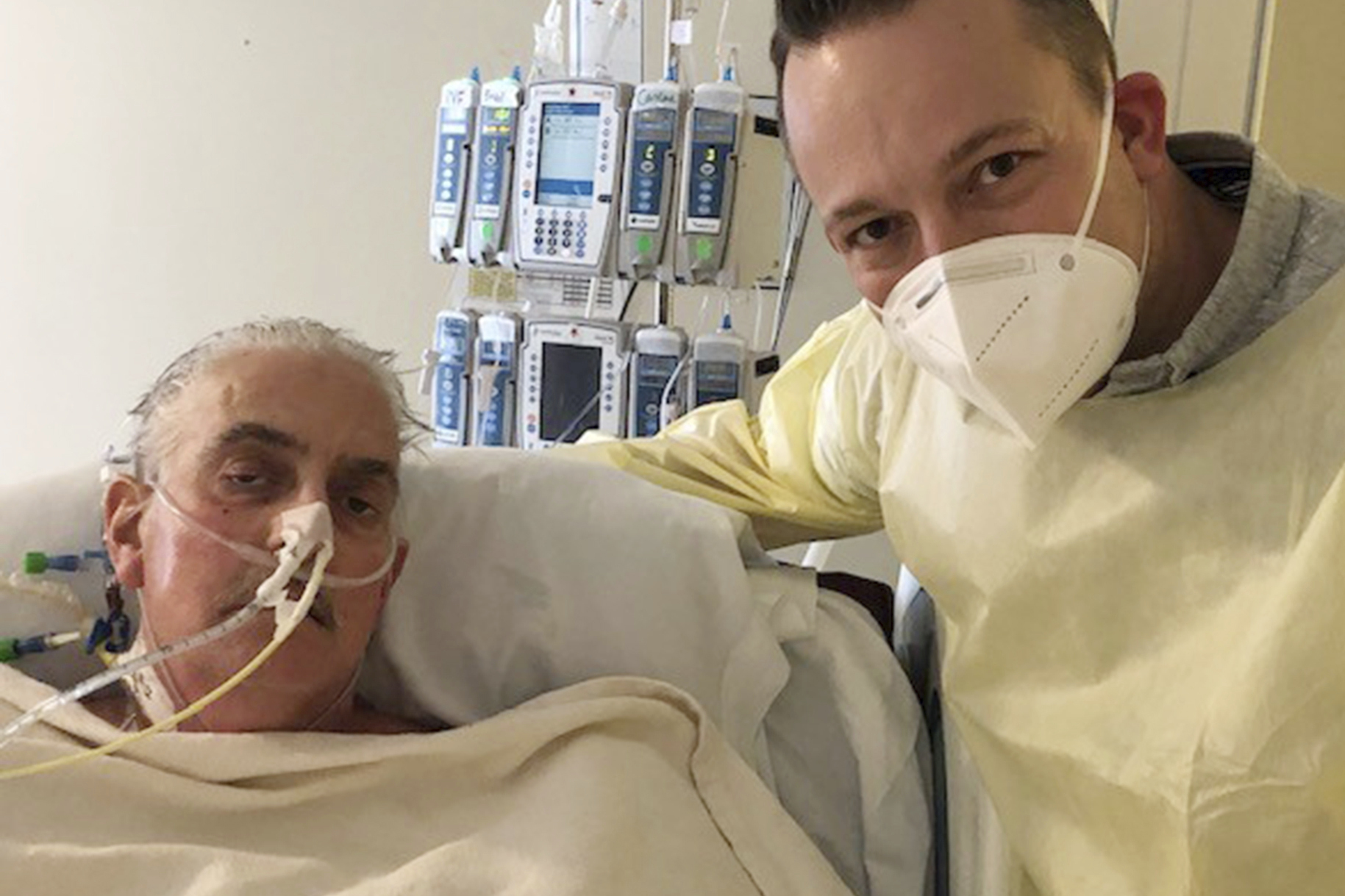 David Bennett posing with his son after operation