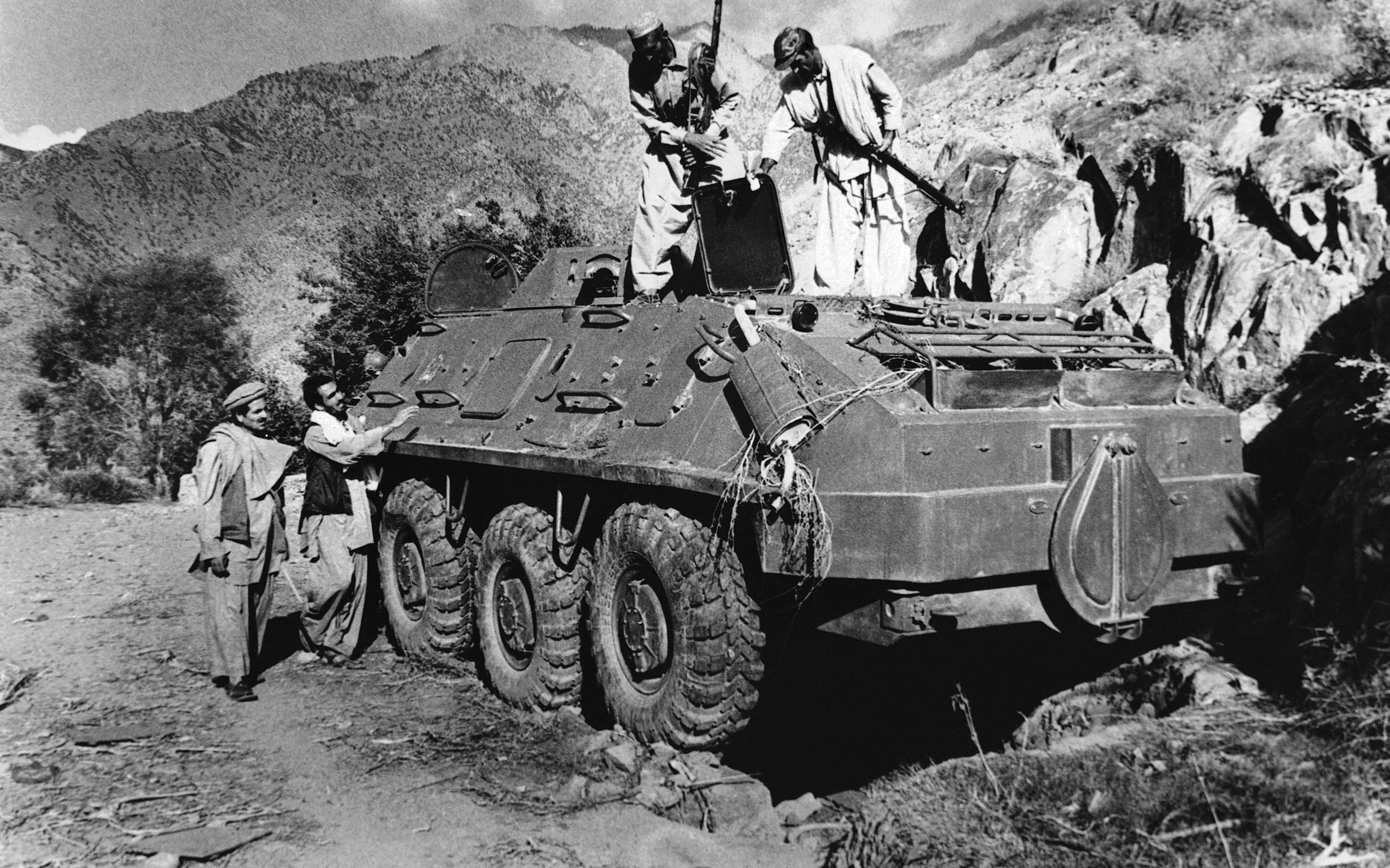 Fighters inspect a captured Soviet tank in 1979