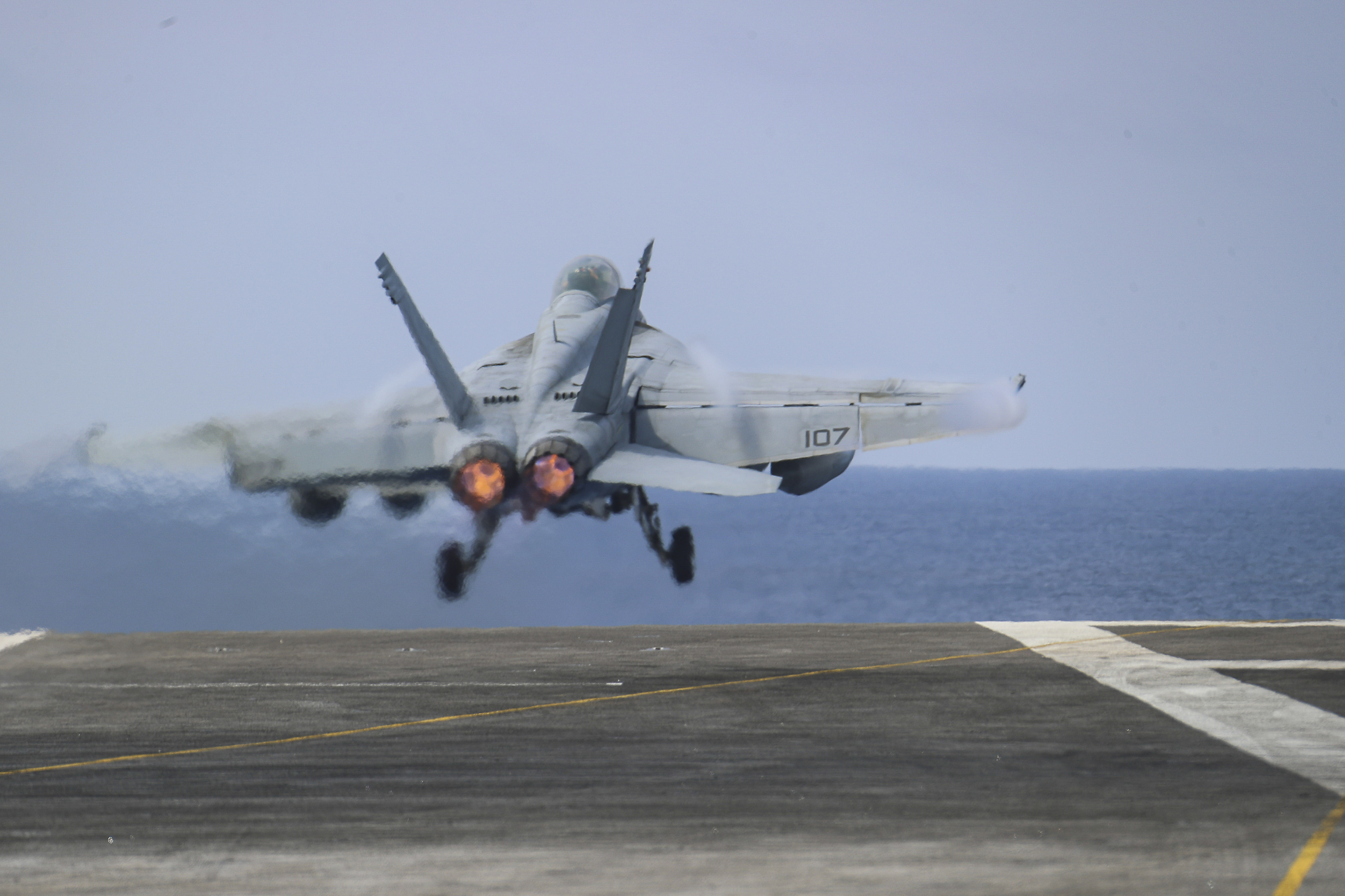 An F-35C fighter jet takes off from the deck of the Abraham Lincoln