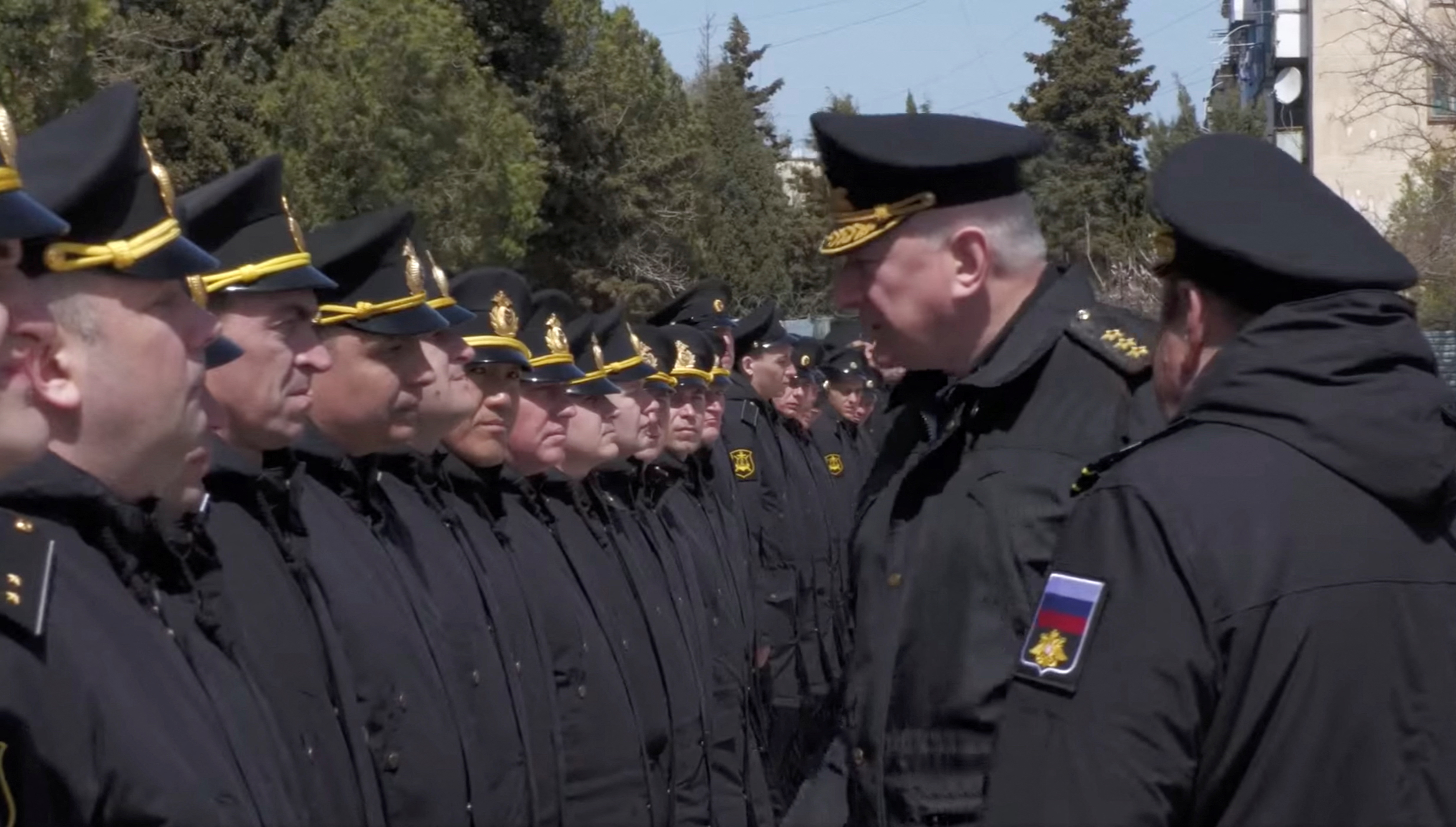 Admiral Nikolai Yevmenov meets crew members of the Moskva following its sinking.
