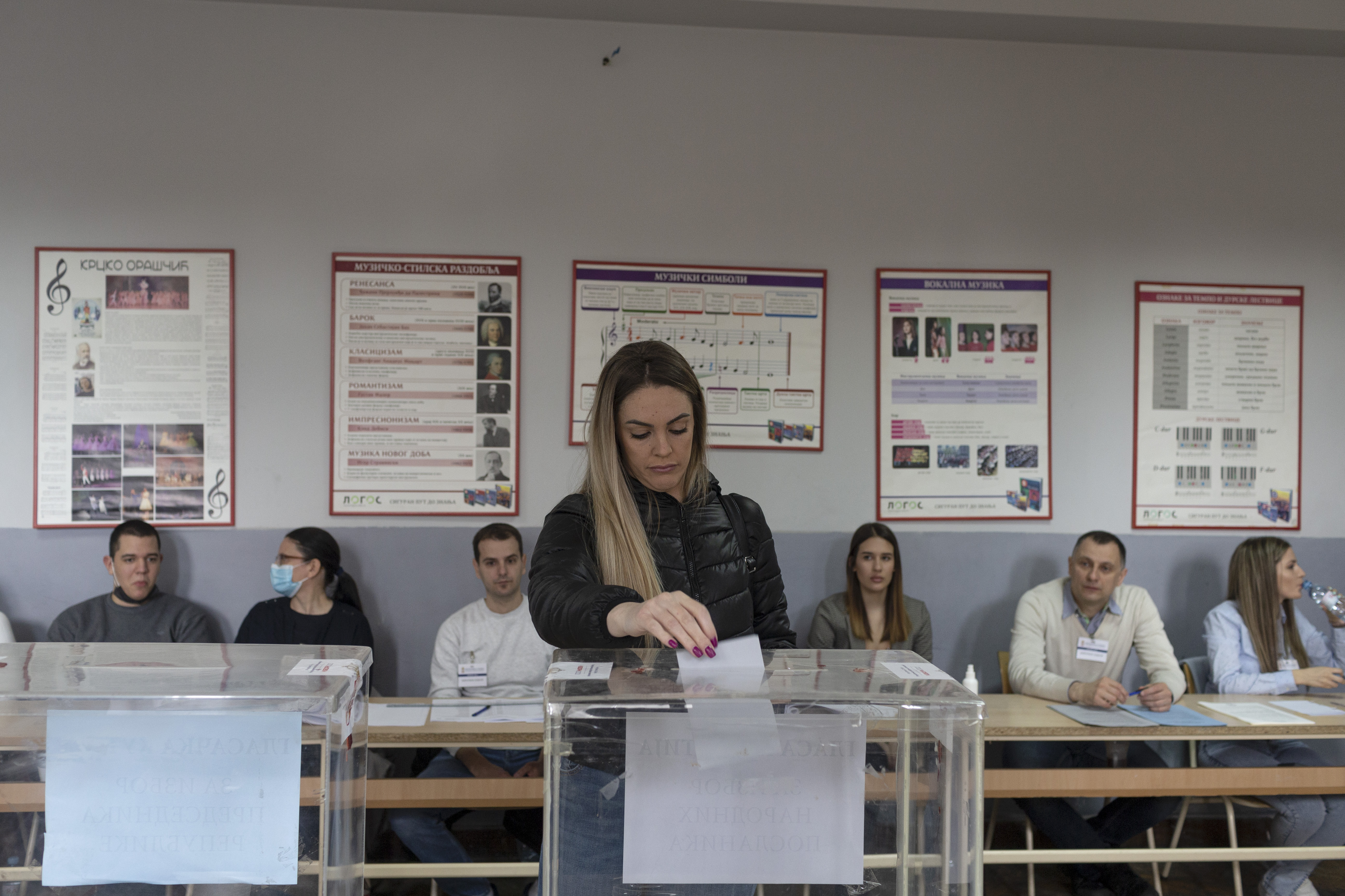 A woman votes at a polling station in Belgrade, Serbia