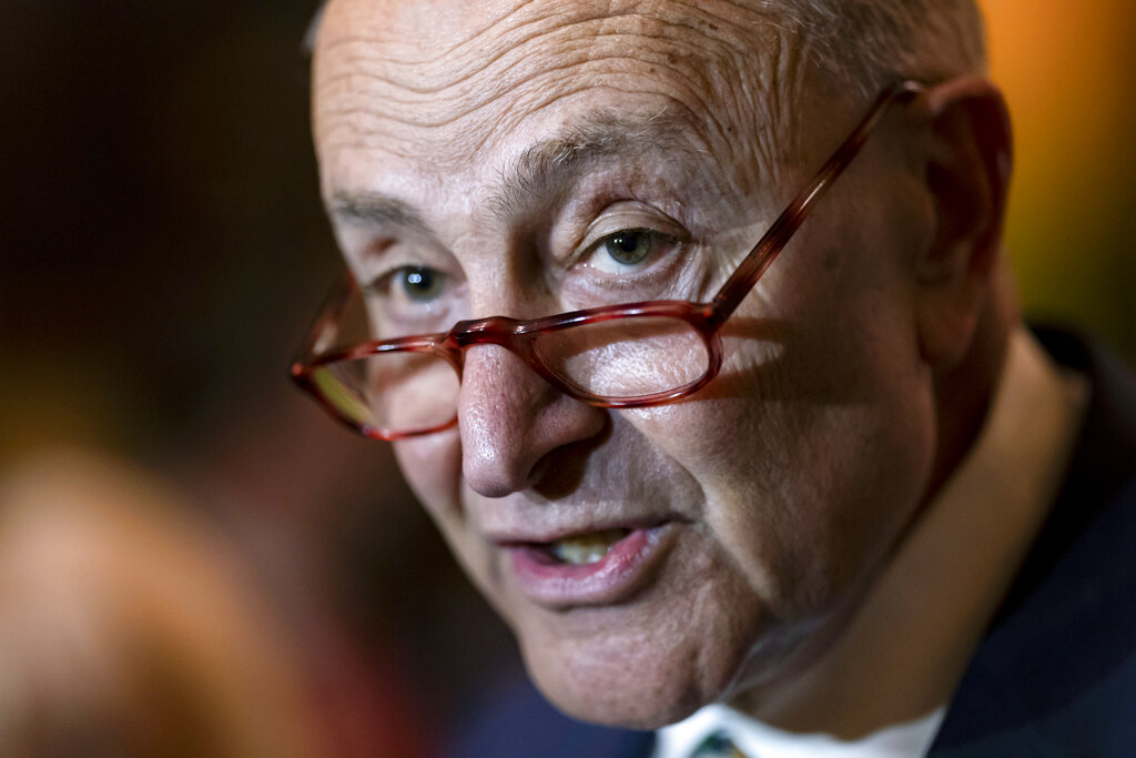 Senate Majority Leader Chuck Schumer meets with reporters following a Democratic Caucus meeting, at the Capitol in Washington.