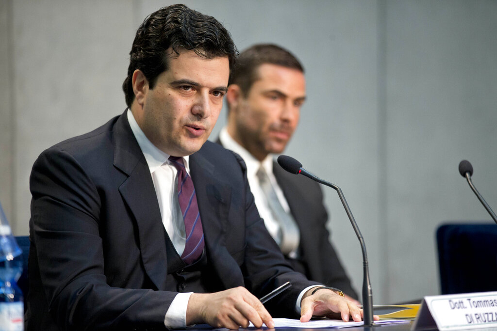Tommaso Di Ruzza, then director of the Vatican Financial Information Authority, left, flanked by Rene Brulhart, then president of the AIF