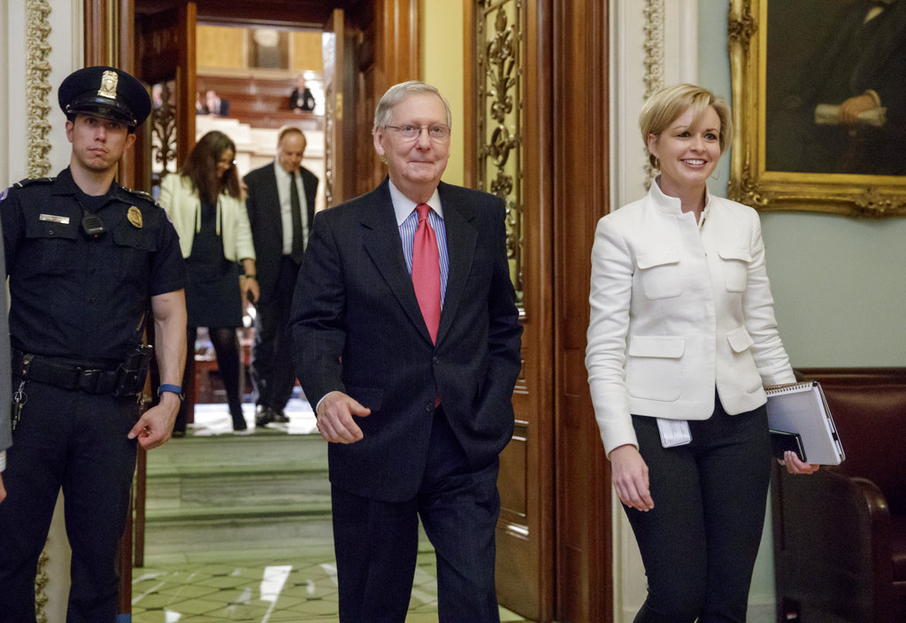 Senate Majority Leader Mitch McConnell, a Republican, smiles leaves the Senate chamber on Capitol Hill in Washington in April 2017, after he led the GOP majority to change Senate rules and lower the vote threshold for Supreme Court nominees from 60 votes to a simple majority in order to advance Neil Gorsuch to a confirmation vote.