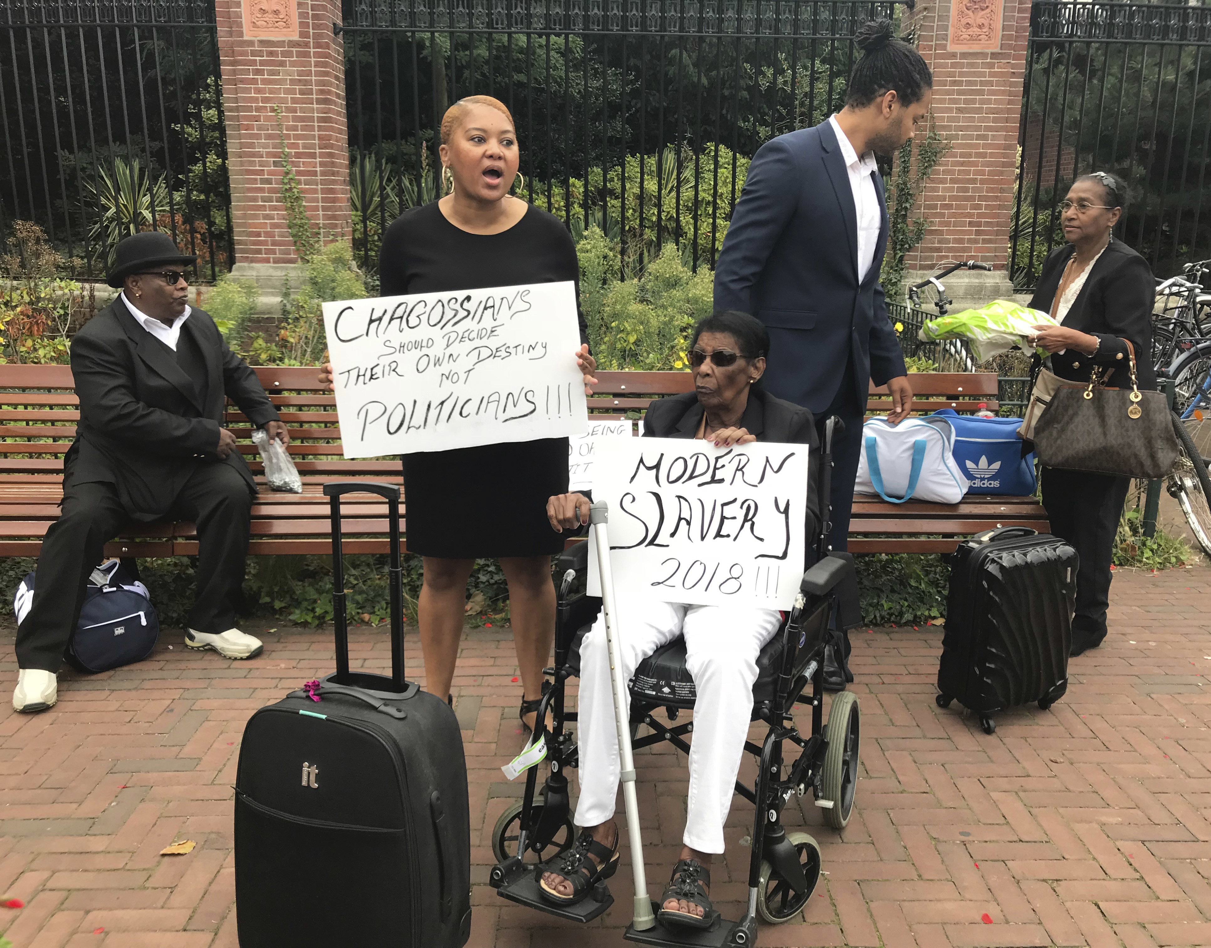 Chagos islanders protest outside the World Court in The Hague as judges consider whether Britain maintains sovereignty illegally