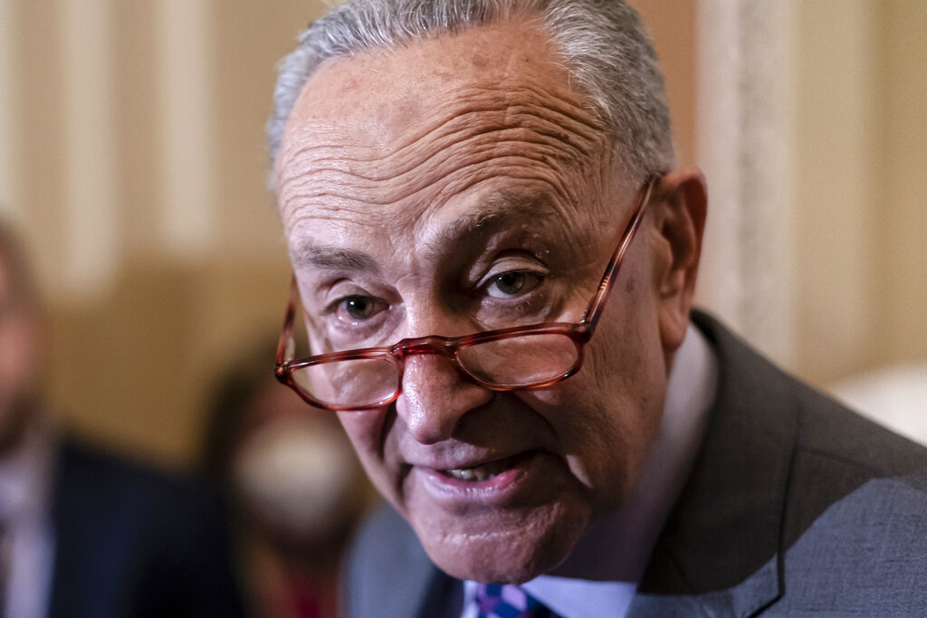 Senate Majority Leader Chuck Schumer, D-N.Y., speaks to reporters ahead of a procedural vote on Wednesday to essentially codify Roe v. Wade, at the Capitol in Washington.