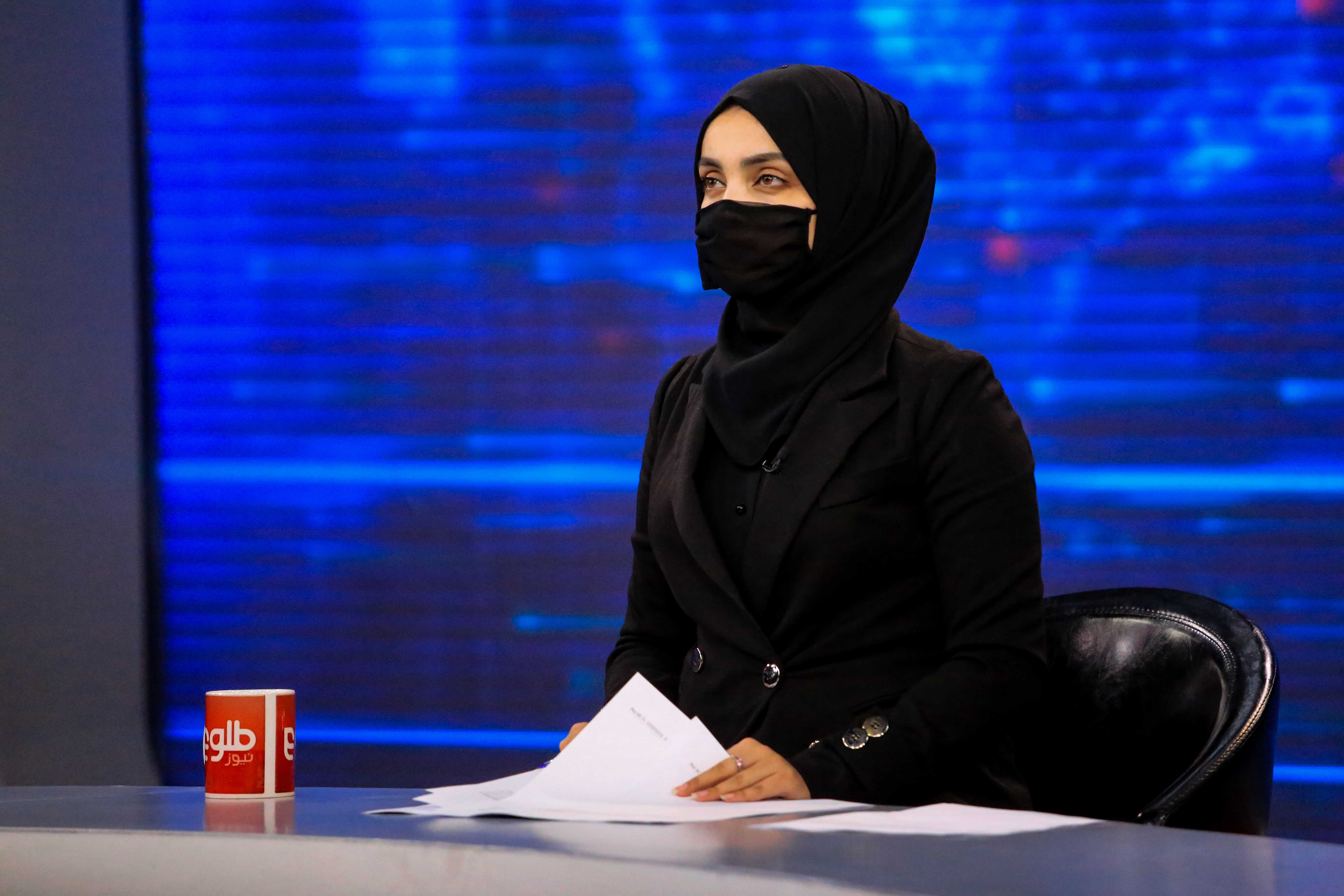 Afghan women cover faces