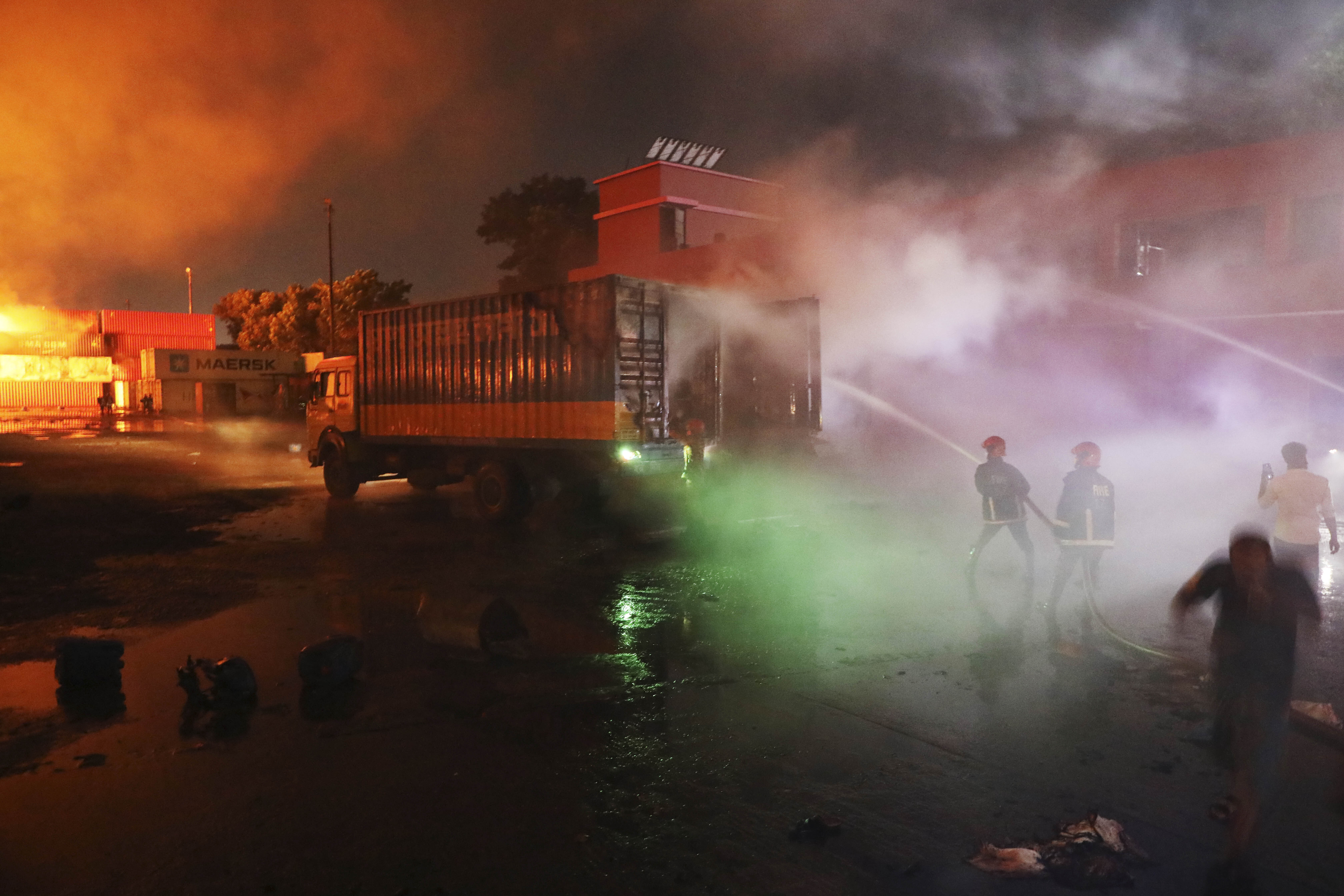 Firefighters work to contain a fire
