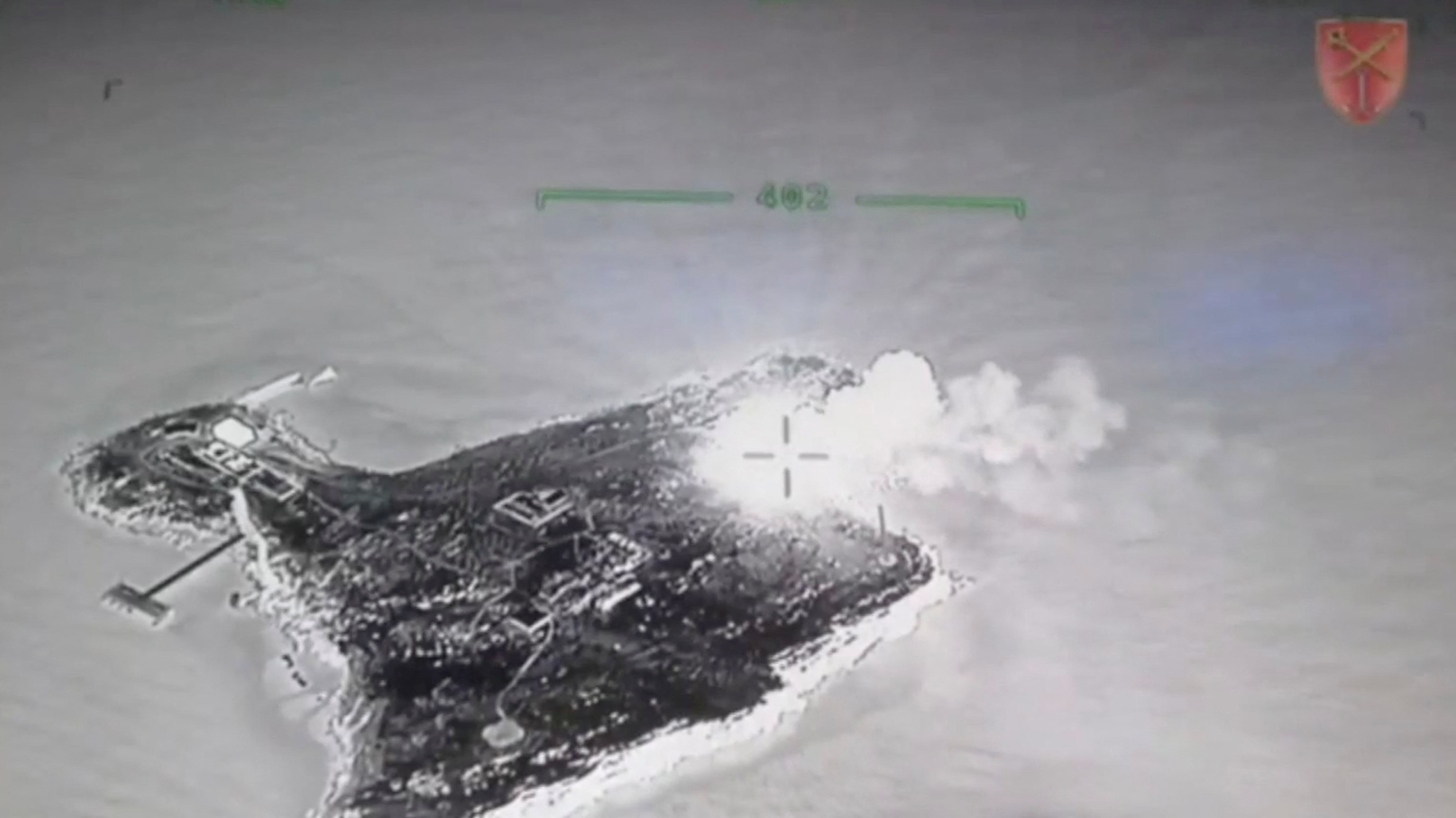 A screengrab taken from a drone video showing a fire on Snake Island.