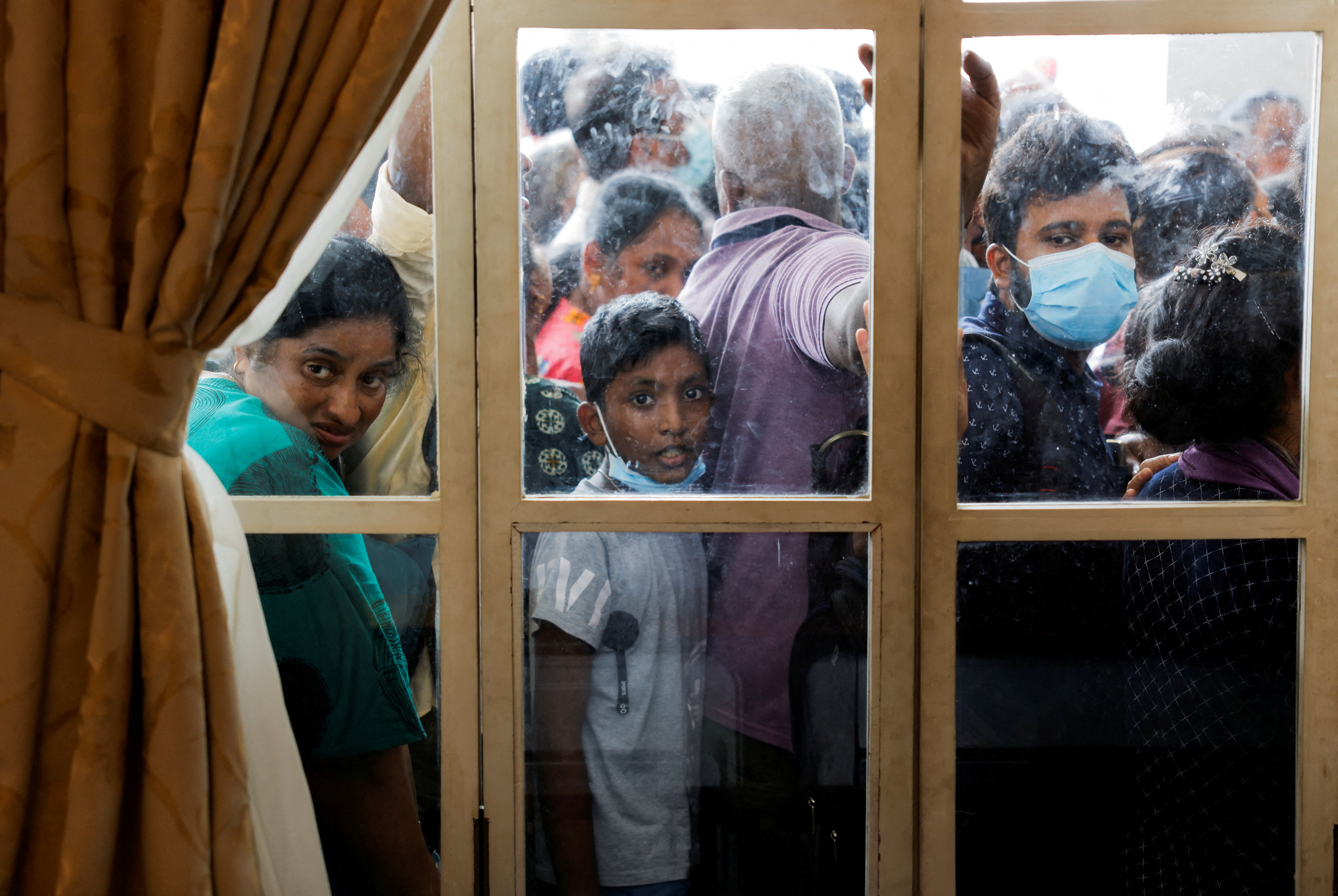 People wait to visit the President's house