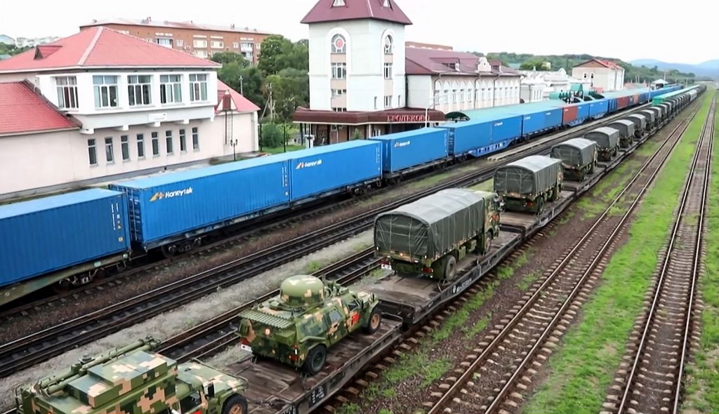 This screen grab obtained from a handout video released by the Russian Defence Ministry on August 29, 2022, shows Chinese armed convoy upon their arrival for 'Vostok-2022' military exercises at the Sergeevsky training ground at Primorskiy (Maritime) Kray of the Russian Far East. - Soldiers from several countries have arrived in eastern Russia for joint military drills that China will take part in, Russia's defence ministry said Monday, amid tensions between Moscow and Western capitals