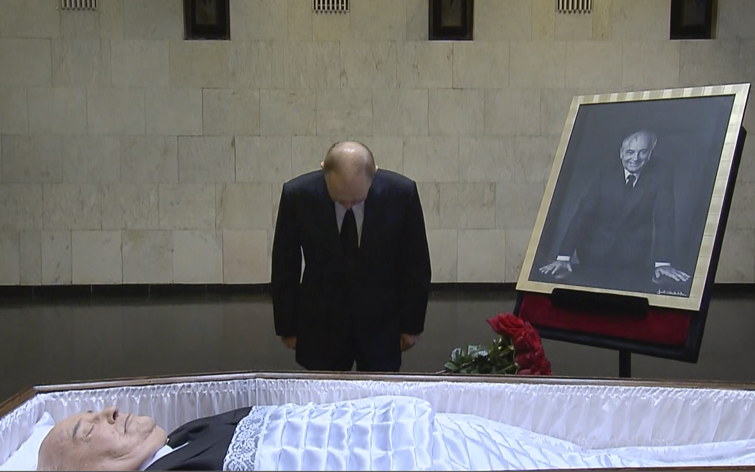 Putin pays his last respect near Gorbachev’s coffin at Central Clinical Hospital in Moscow [Russian pool via AP]