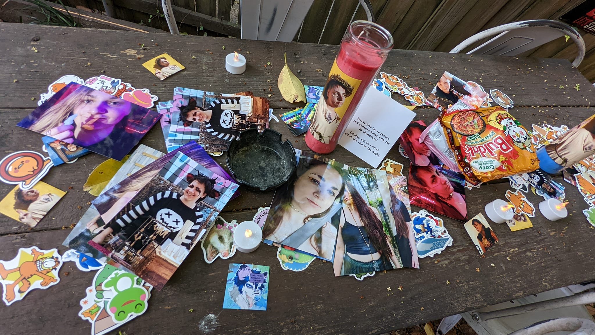 The patio tables at Sleepyfest were covered in stickers, photos of Sleepy, and their favourite instant ramen for guests to bring home [Courtesy of Mike Goetz and CM Soto]