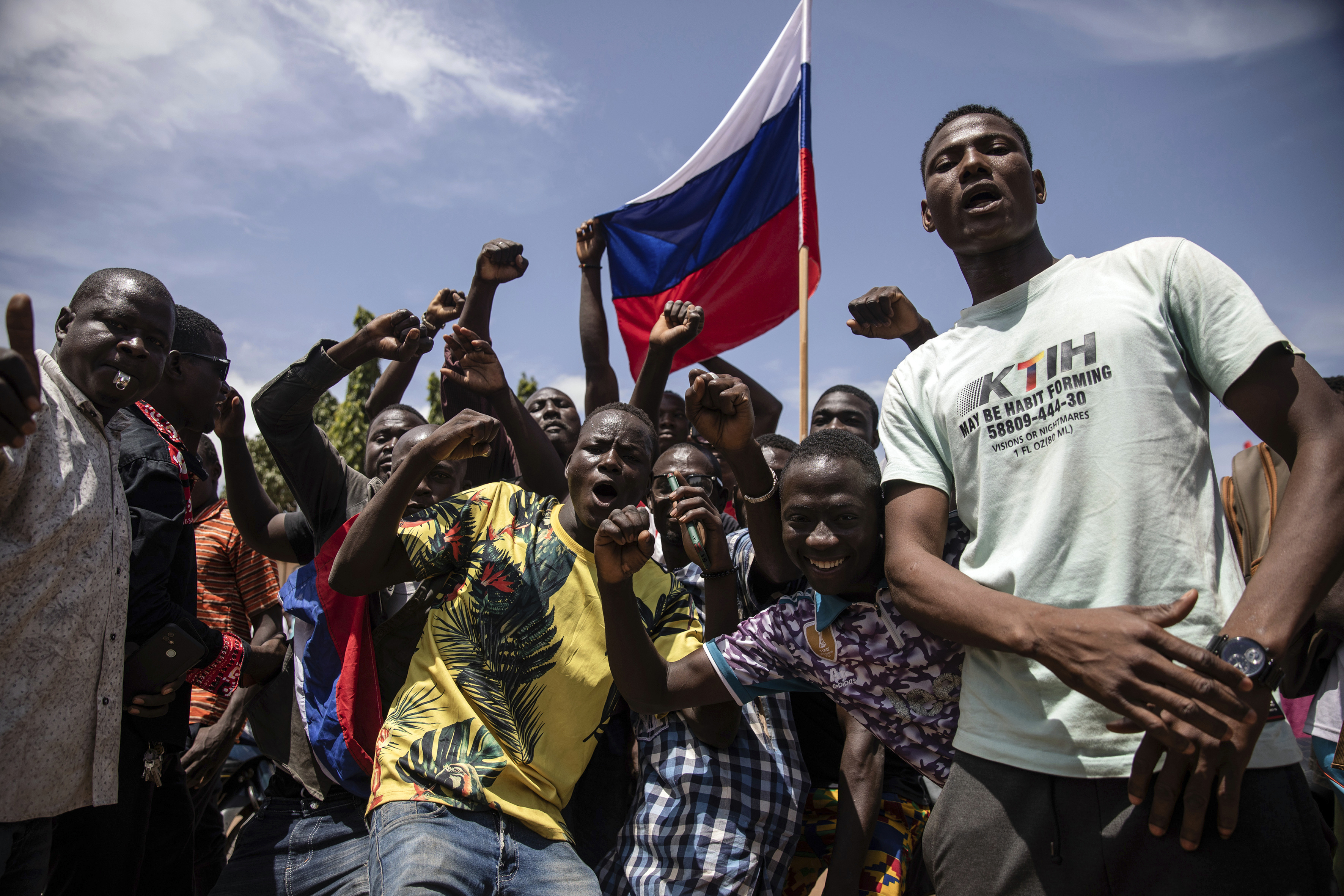 Young men chant slogans against the power of Lieutenant-Colonel Damiba and France, as well as pro-Russian sentiment, in Ouagadougou, Burkina Faso, Friday, September 30, 2022