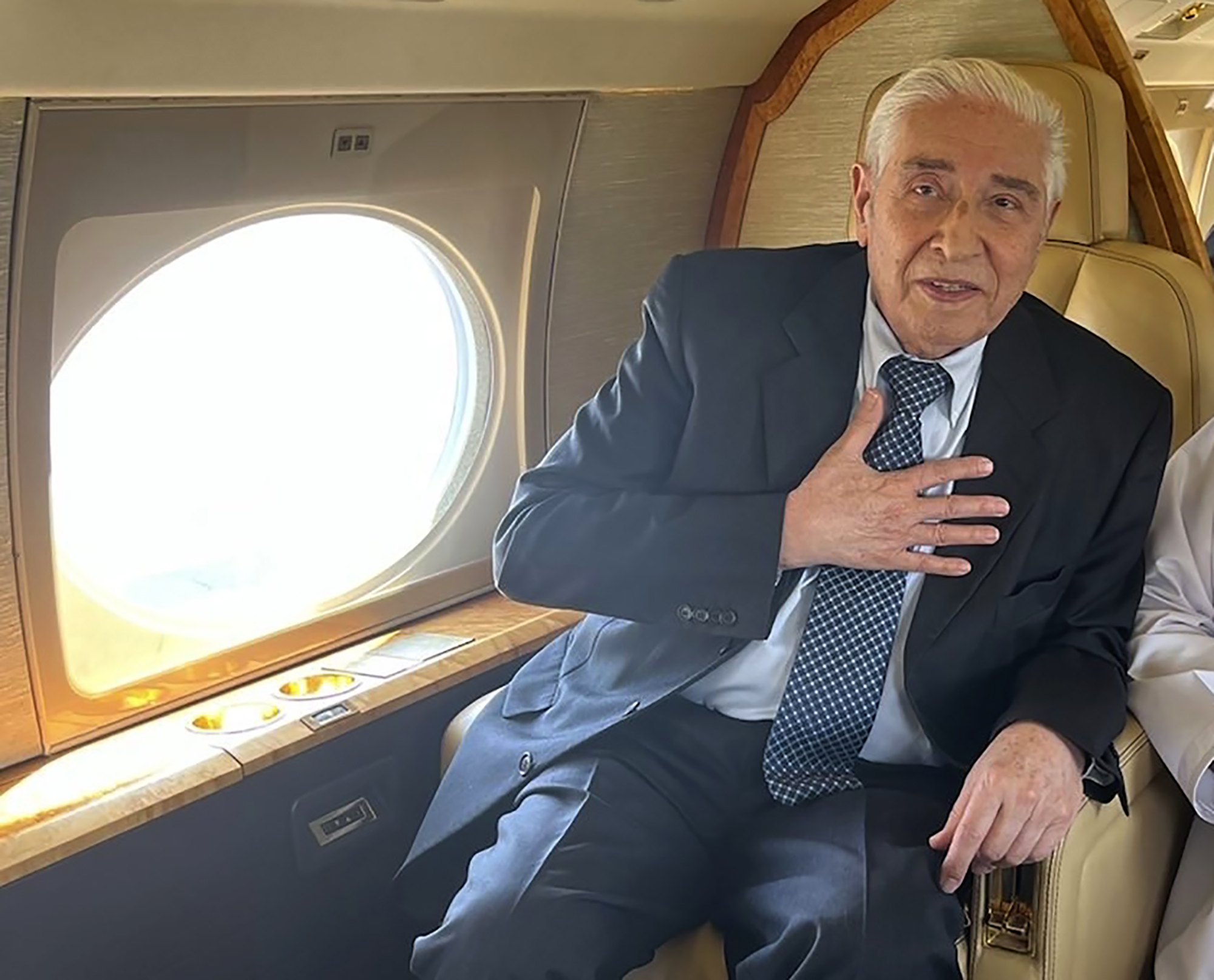 Baquer Namazi is seen on board of the plane that took him to Oman.