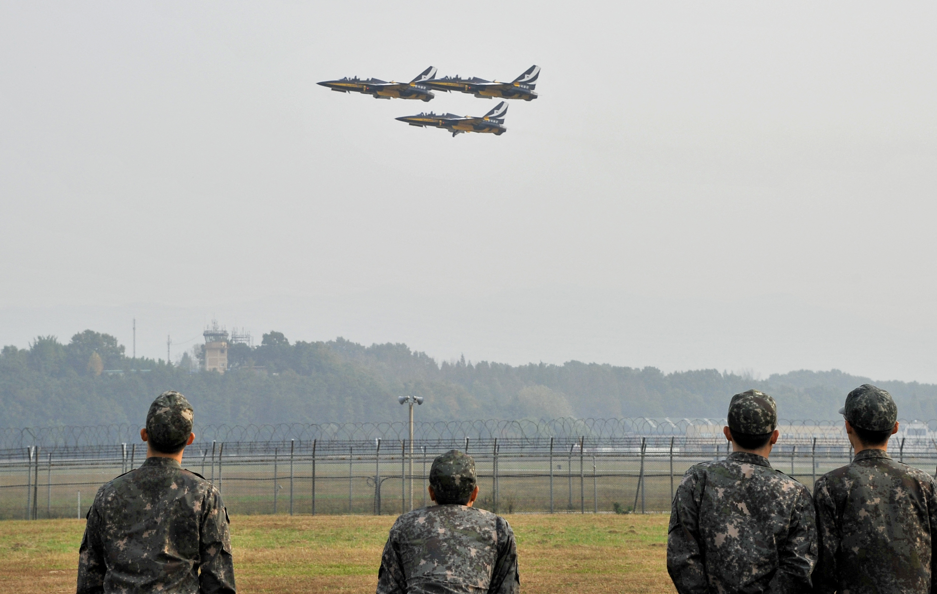 Three South Korean fighter jets take off during an air show at a military air base in Cheongju, South Korea.