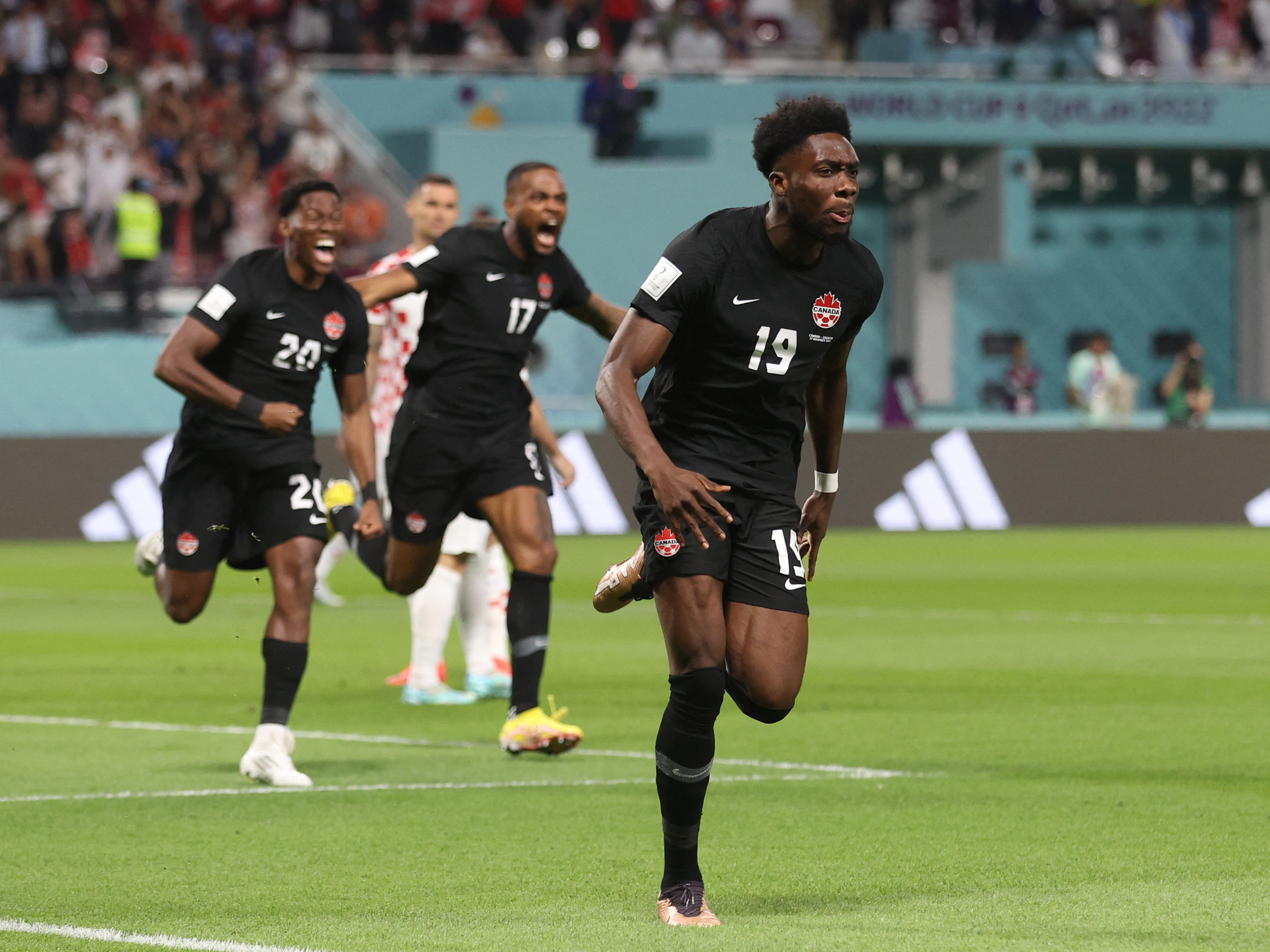 Alphonso Davies celebrates scoring Canada's first-ever World Cup goal