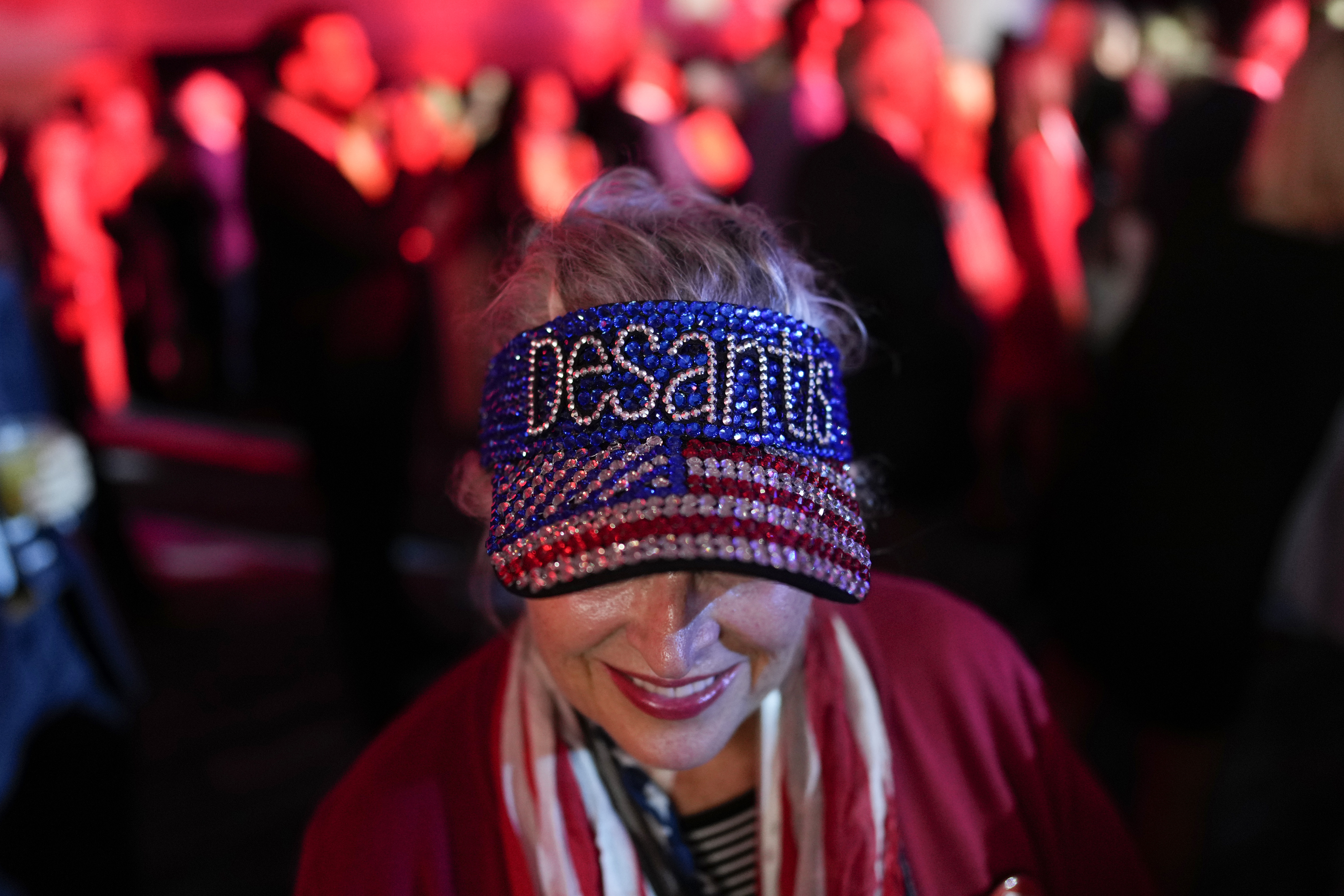 A woman arrives before Incumbent Florida Republican Gov. Ron DeSantis speaks to supporters.