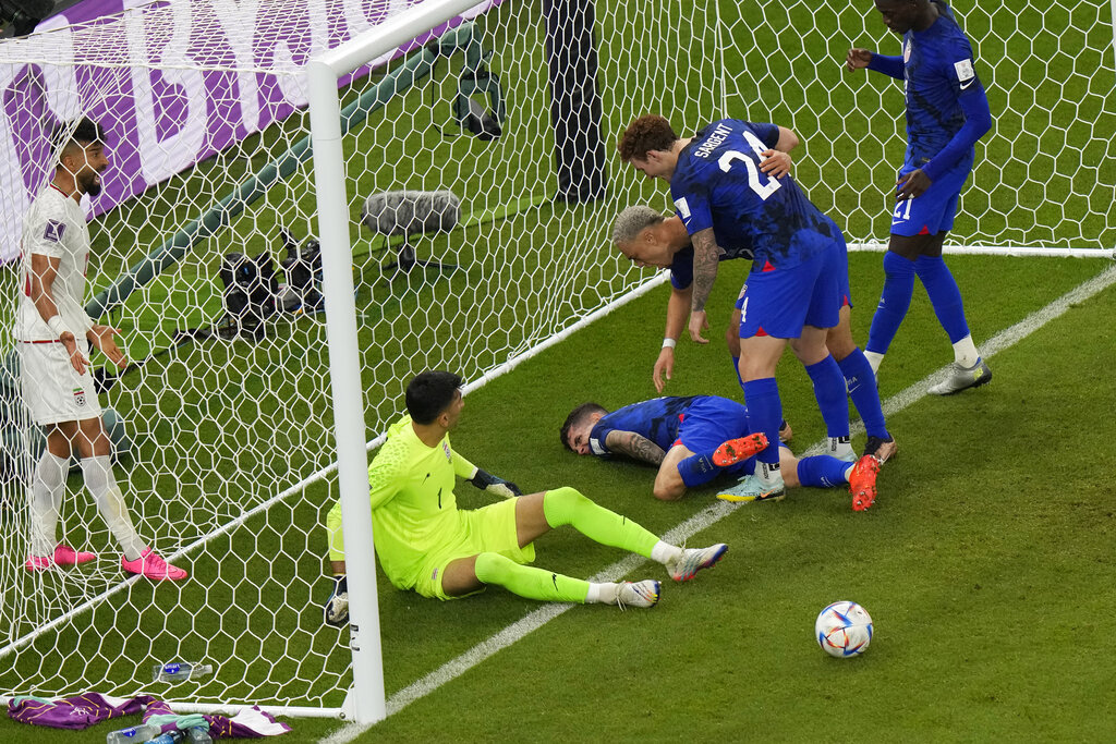 Christian Pulisic of the United States lays injured on the pitch after scoring his side’s opening goal during the World Cup Group B match between Iran and the US at the Al Thumama Stadium in Doha, Qatar on November 29, 2022