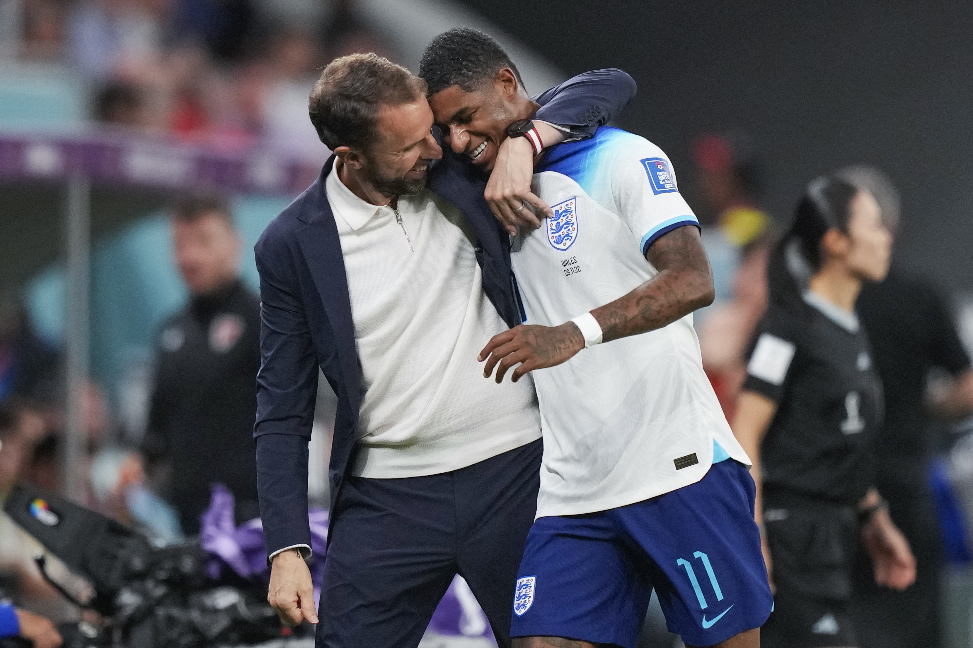 England's Marcus Rashford, right, is greeted by England's head coach Gareth Southgate as he leaves the pitch