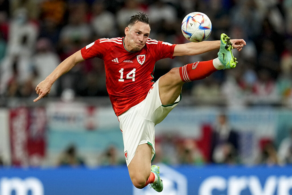 Wales’s Connor Roberts reaches for the ball during the Group B match between England and Wales, at the Ahmad Bin Ali Stadium, November 29, 2022