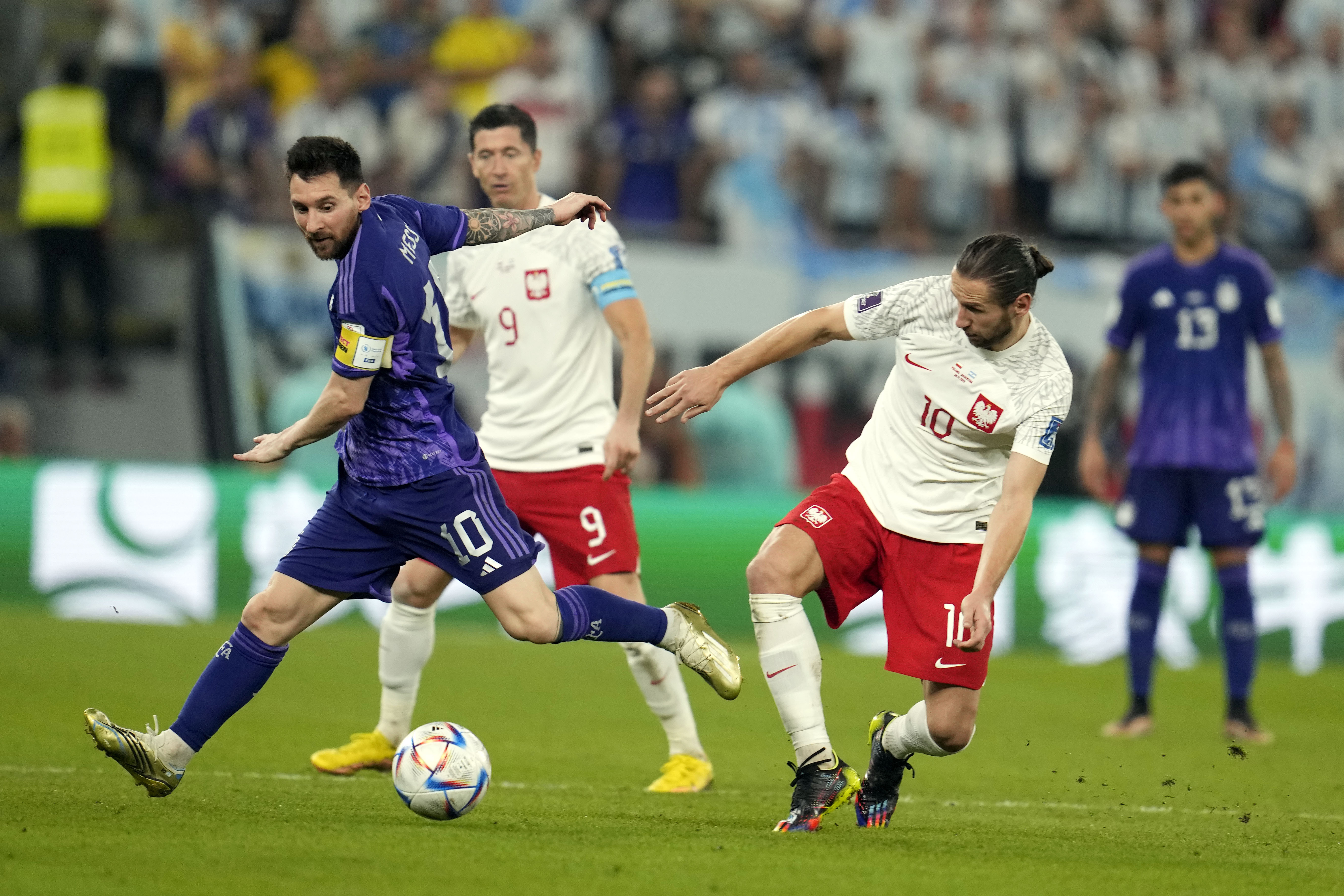 rgentina's Lionel Messi, left, and Poland's Grzegorz Krychowiak, right, battle for the ball during the World Cup group C soccer match between Poland and Argentina at the Stadium 974 in Doha, Qatar, Wednesday, Nov. 30, 2022. (AP Photo/Natacha Pisarenko)