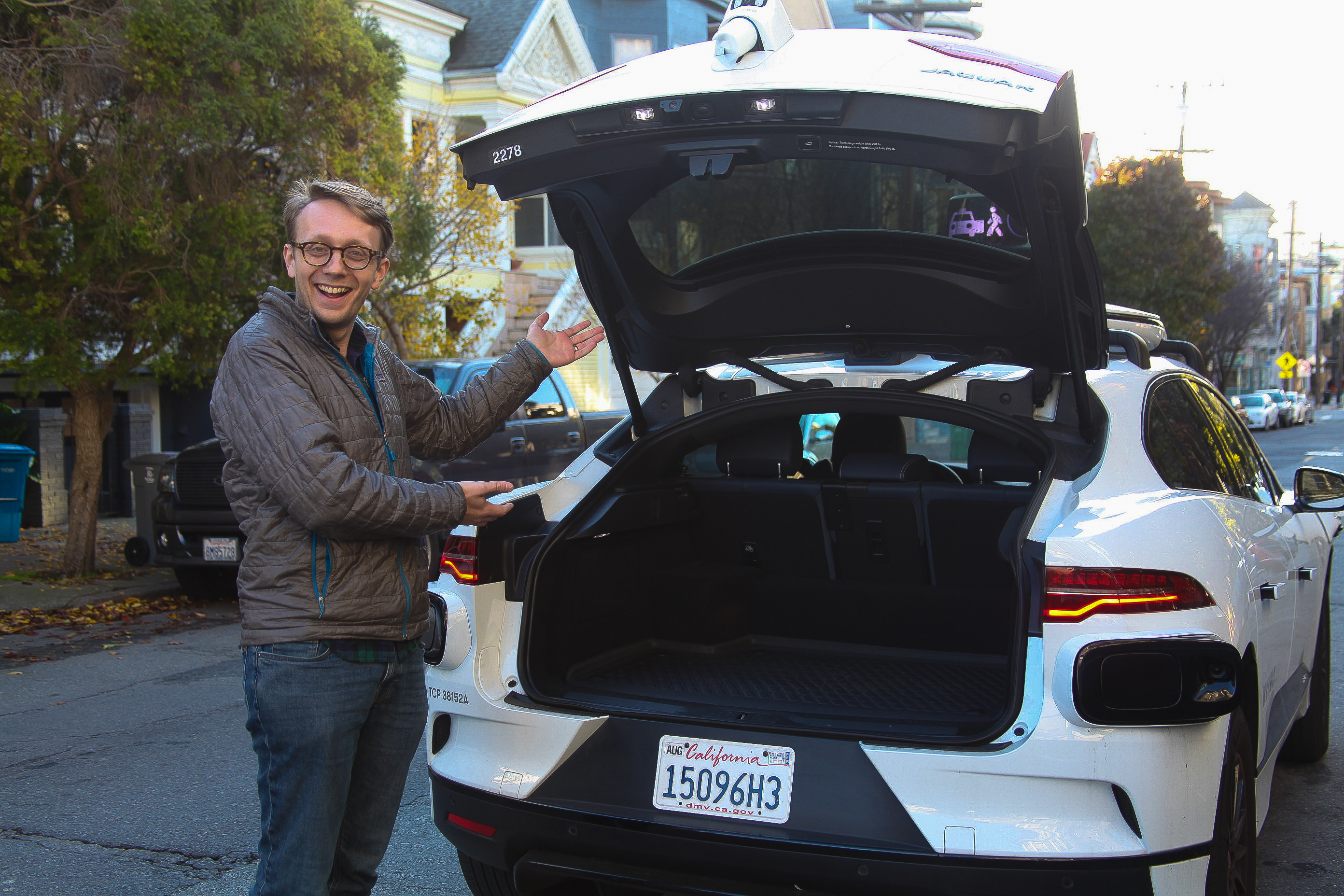 Product manager Jack Wanderman demonstrates the storage space in the Waymo ‘fifth-generation driver’. Previous generations housed servers in the boot