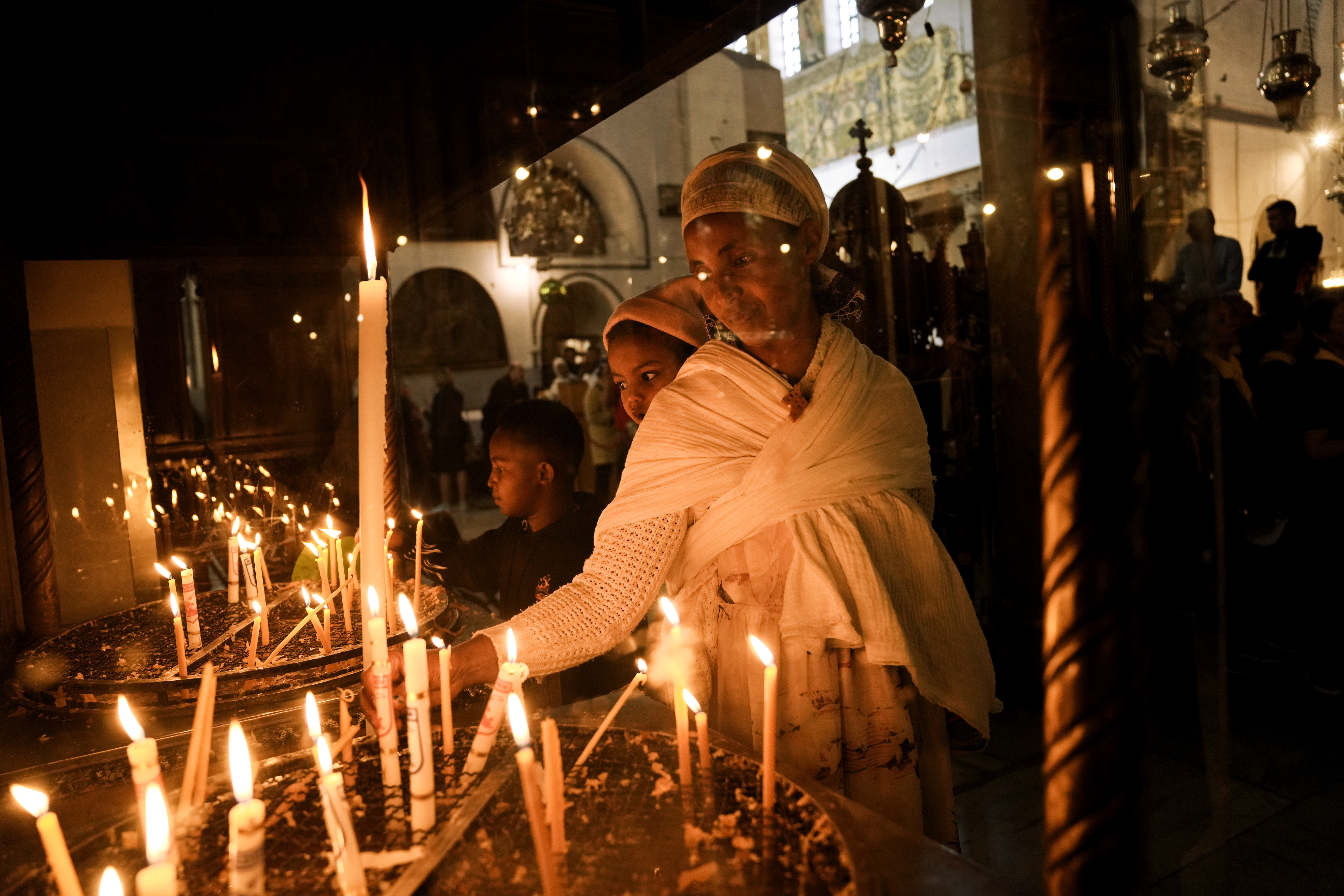 An Ethiopian woman and her child visit the Church of the Nativity,
