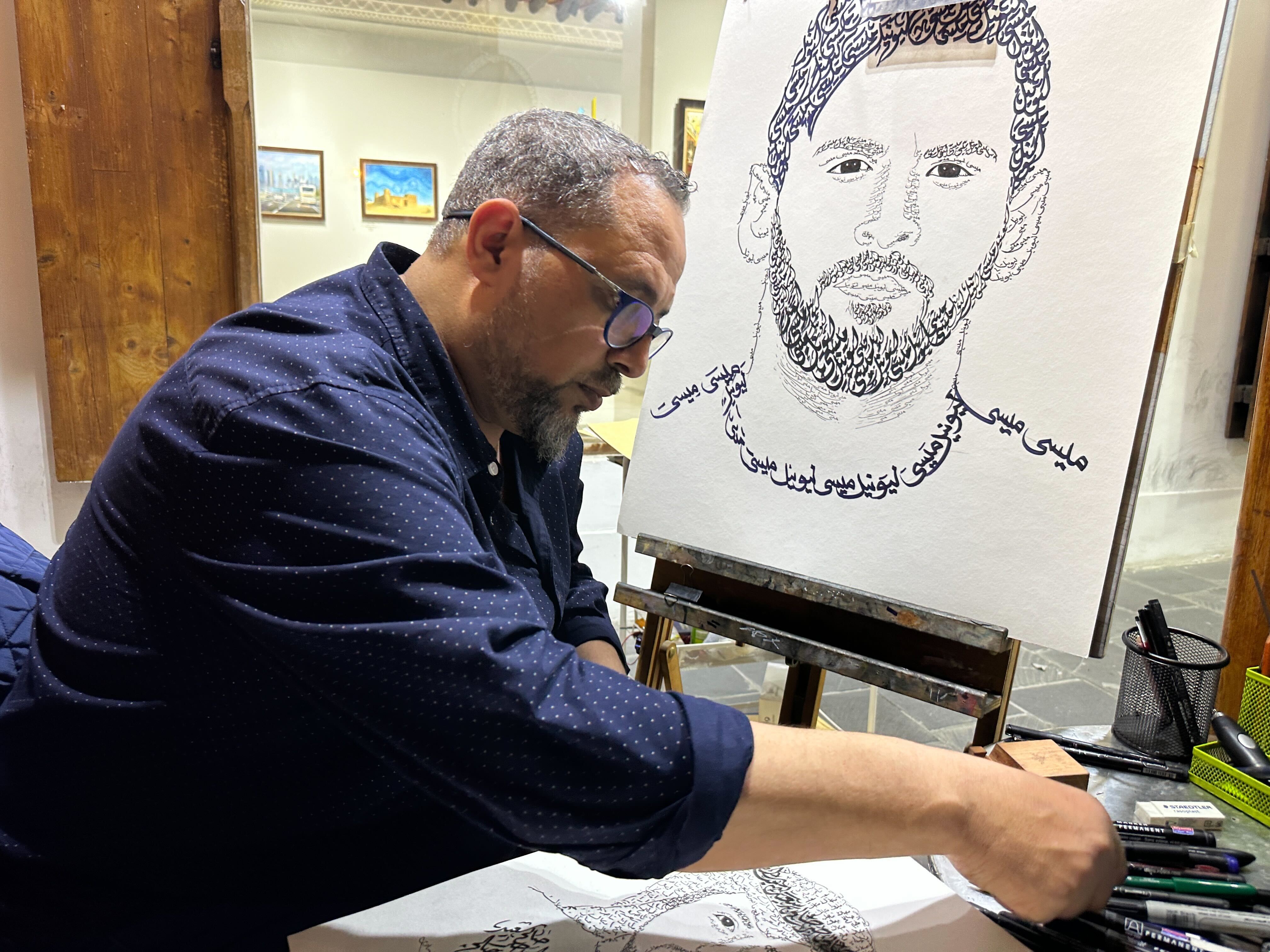 Khaled al Mesawy sketching in Souq Waqif