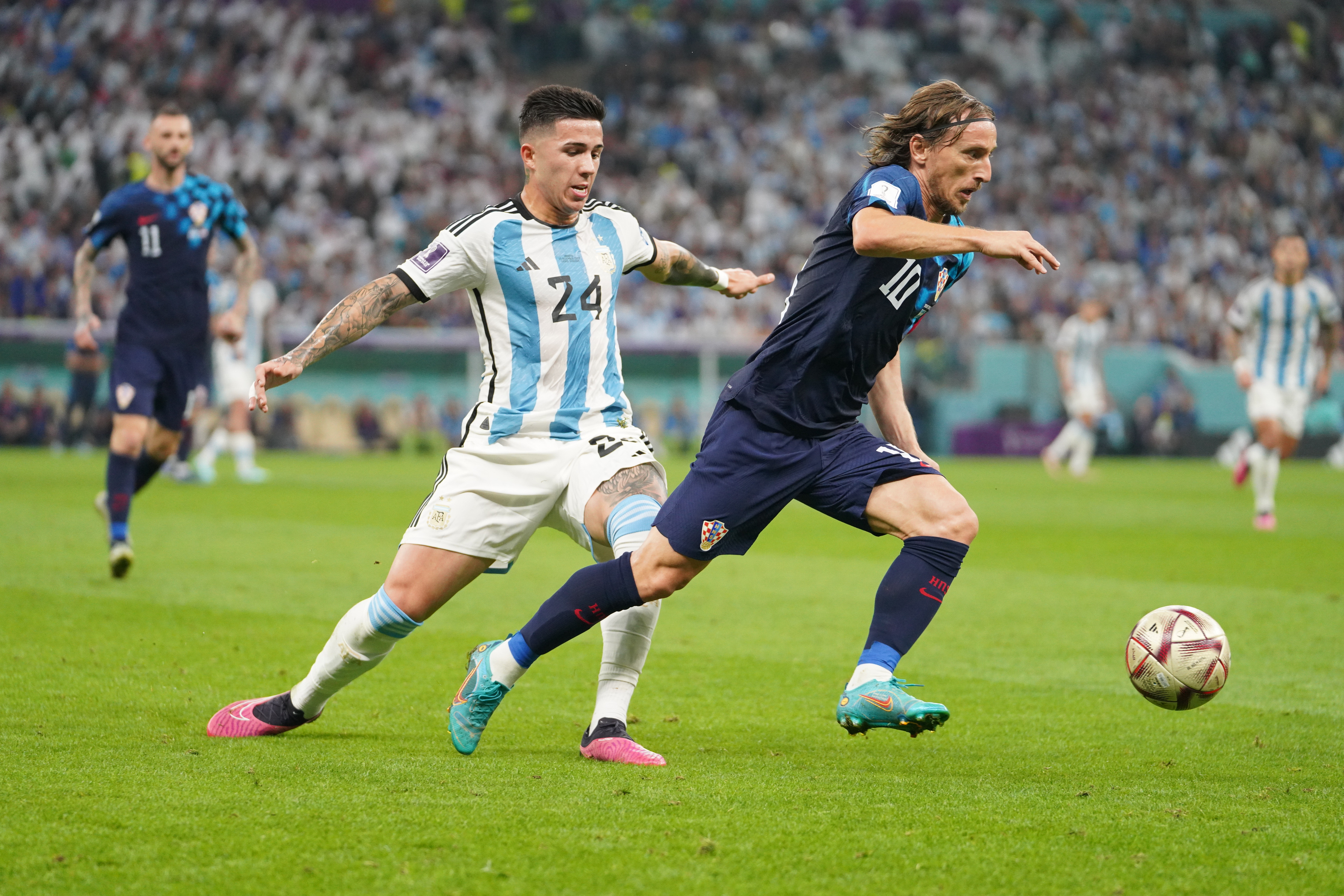 Luka Modric in action with Enzo Fernandez