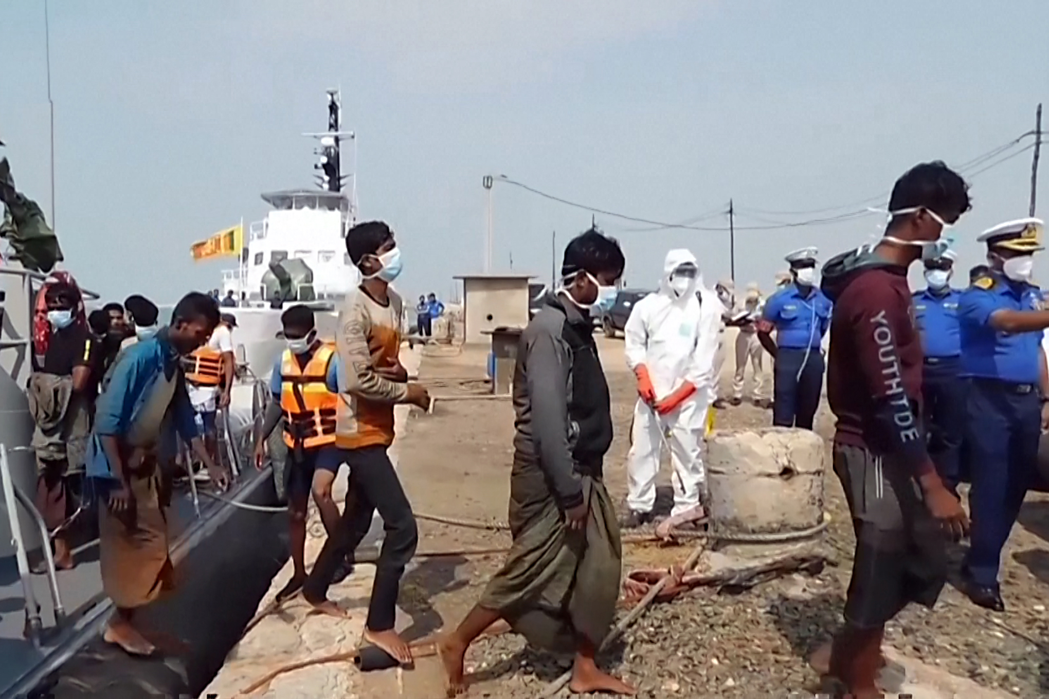 Sri Lankan navy rescuing over 100 Rohingya refugees adrift in rough seas in December 2022 [File: Sri Lanka Navy via Reuters]