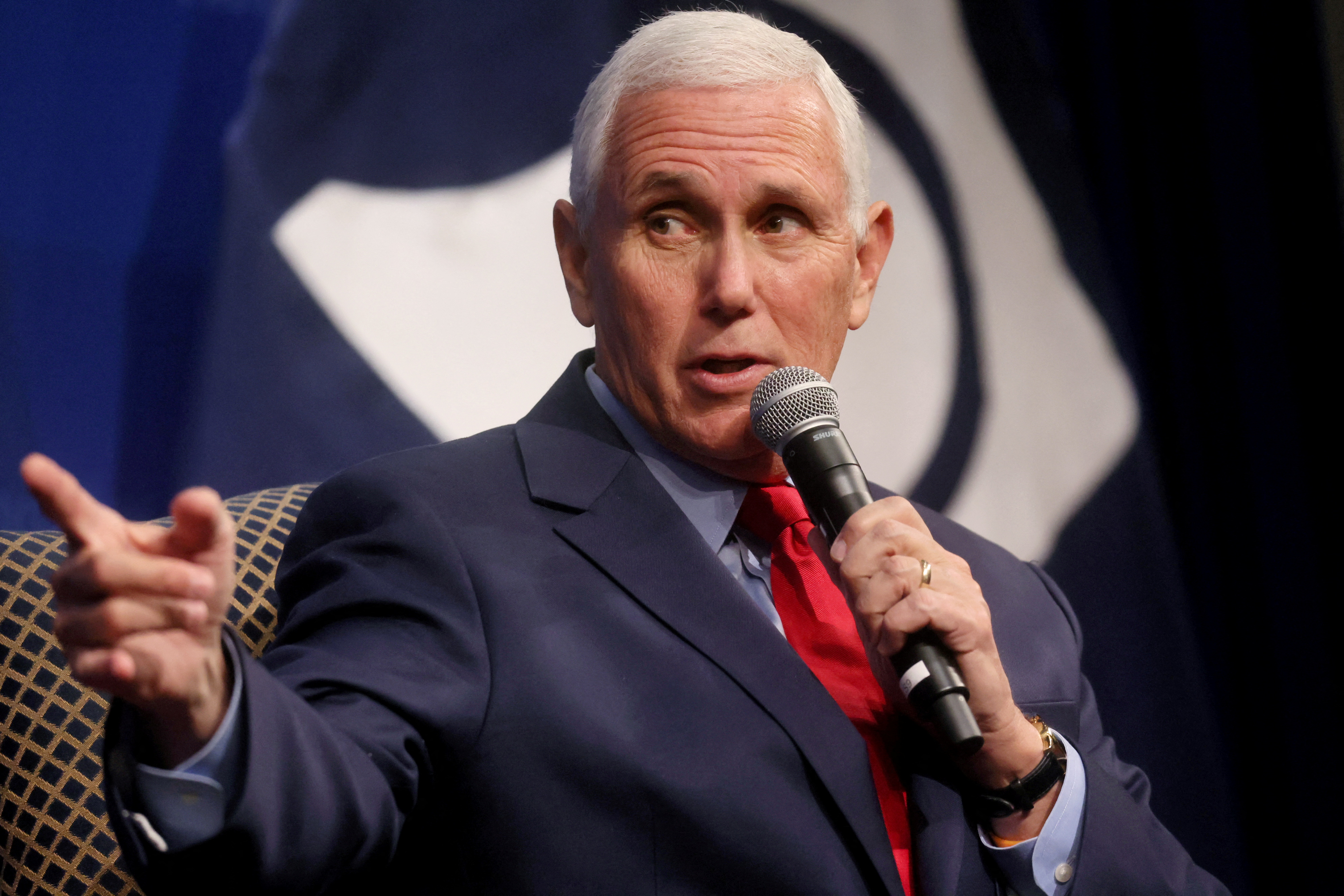 Mike Pence speaks into a microphone at the Heritage Foundation