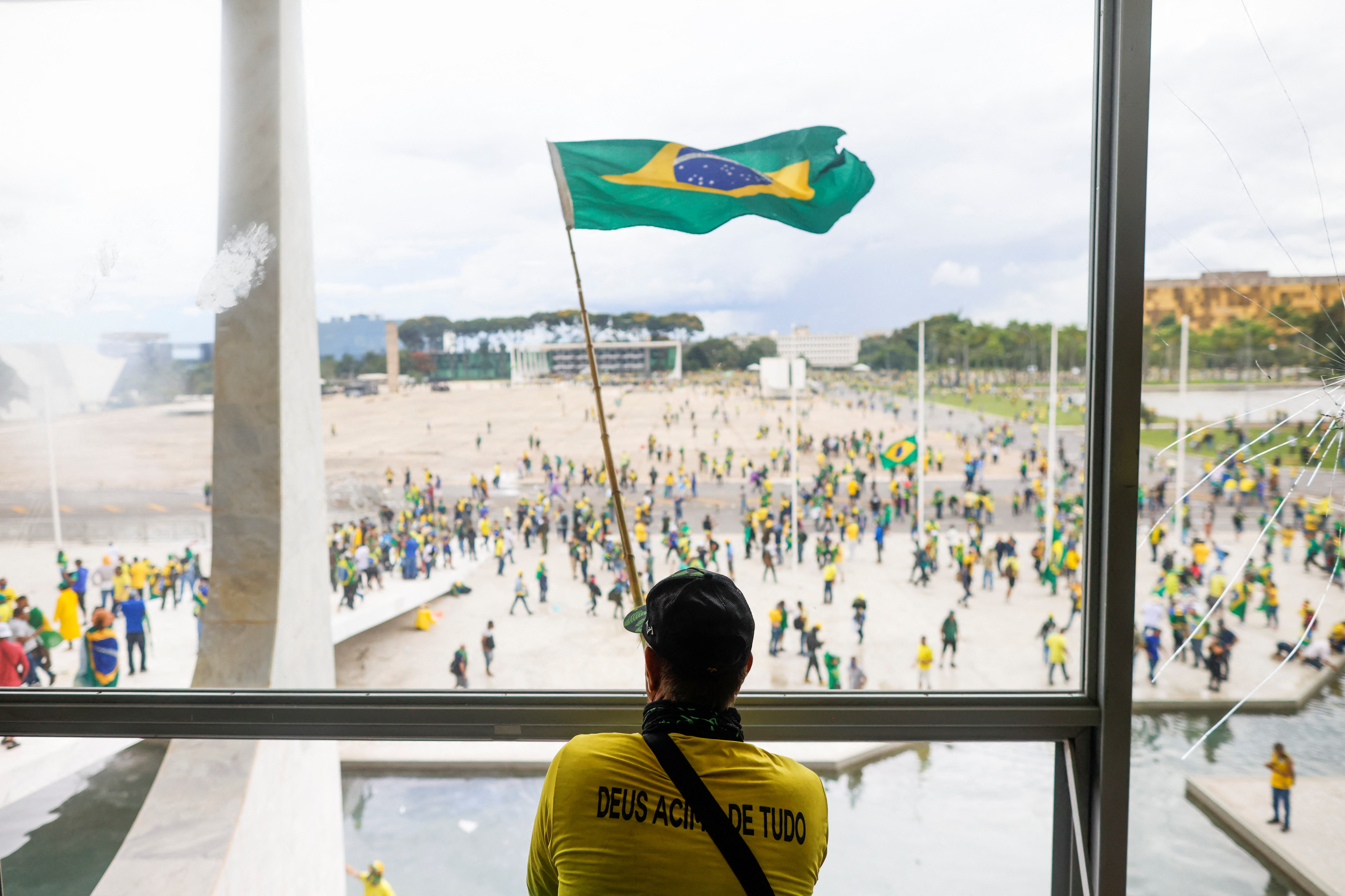 A man waves Brazil’s flag as supporters of Brazil’s former President Jair Bolsonaro demonstrate against President Luiz Inacio Lula da Silva at Brazil’s National Congress in Brasilia, Brazil