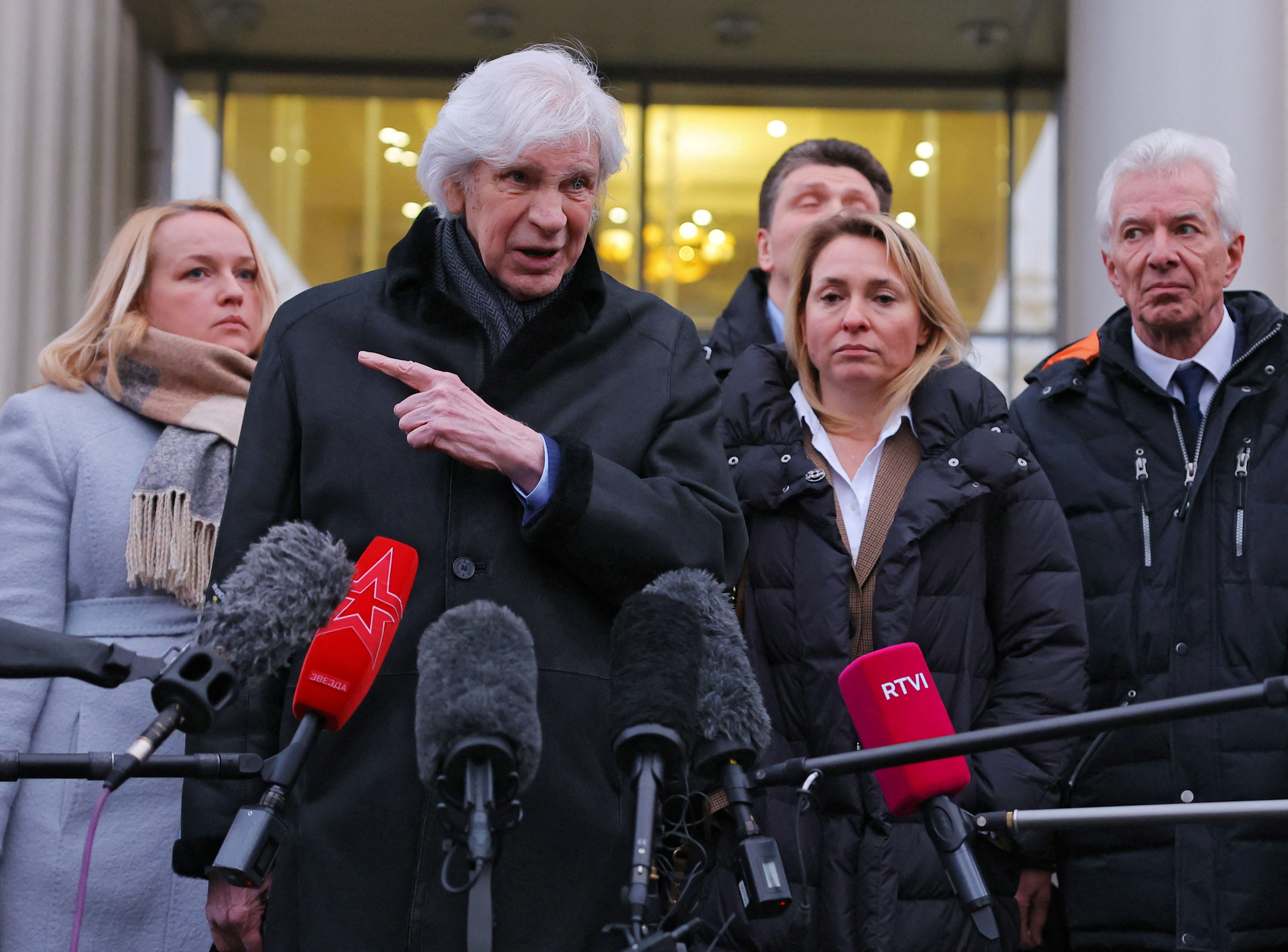 Lawyer Genri Reznik speaks to the media next to members and lawyers of the Moscow Helsinki Group