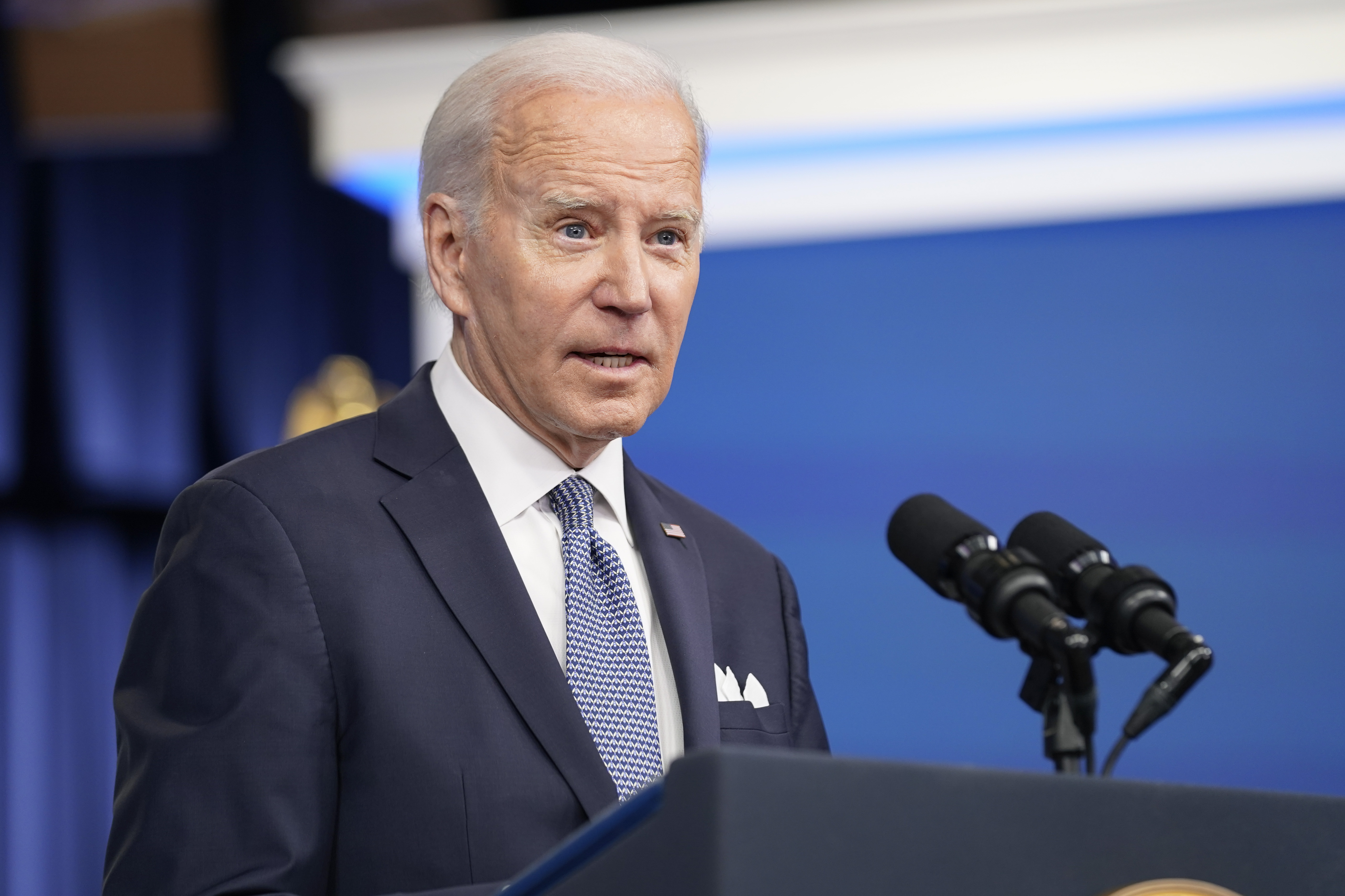 US President Joe Biden talking at a lectern.