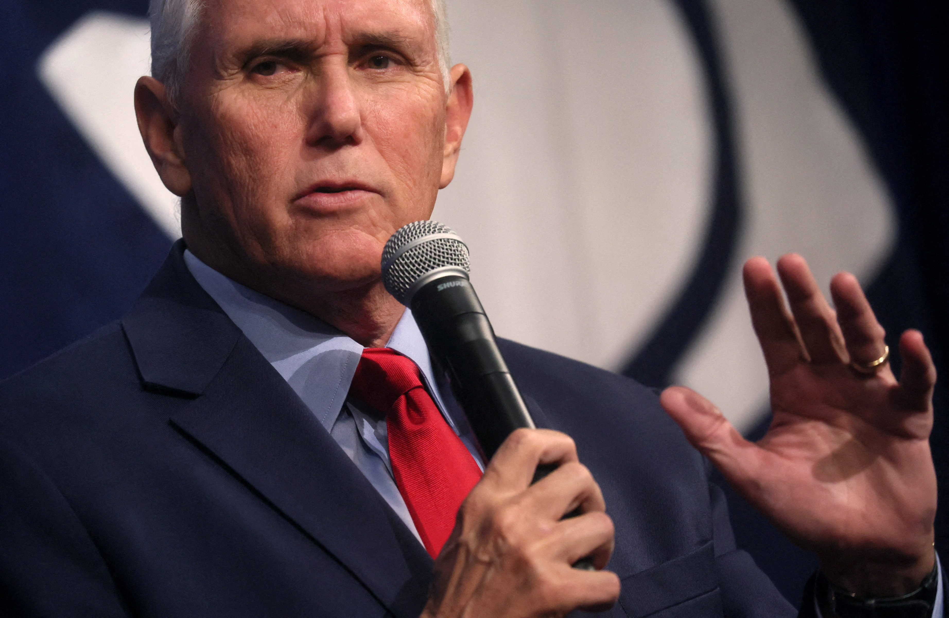 Mike Pence speaks into microphone